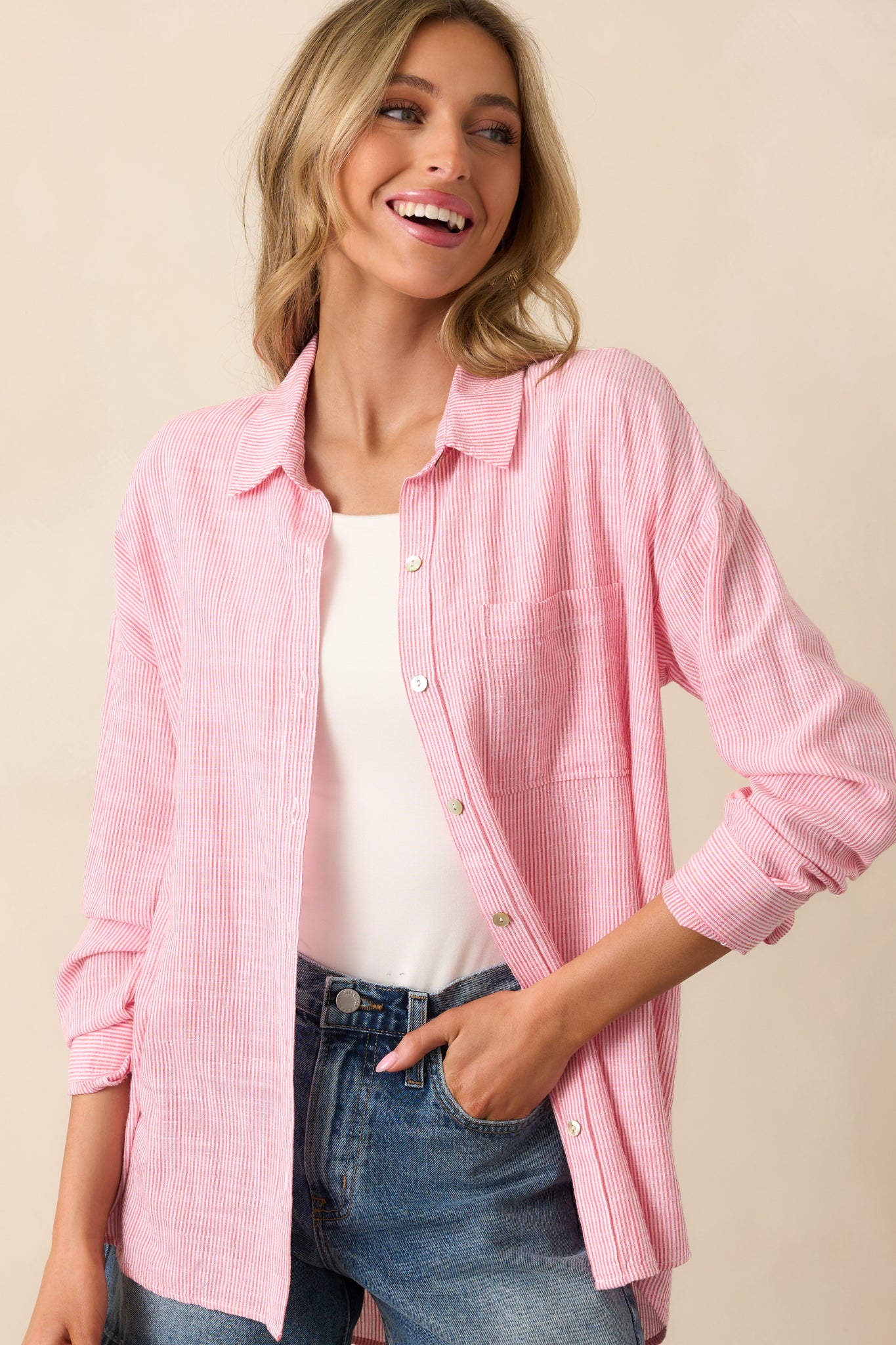 A close-up of the collared neckline, focusing on the fabric and button details.