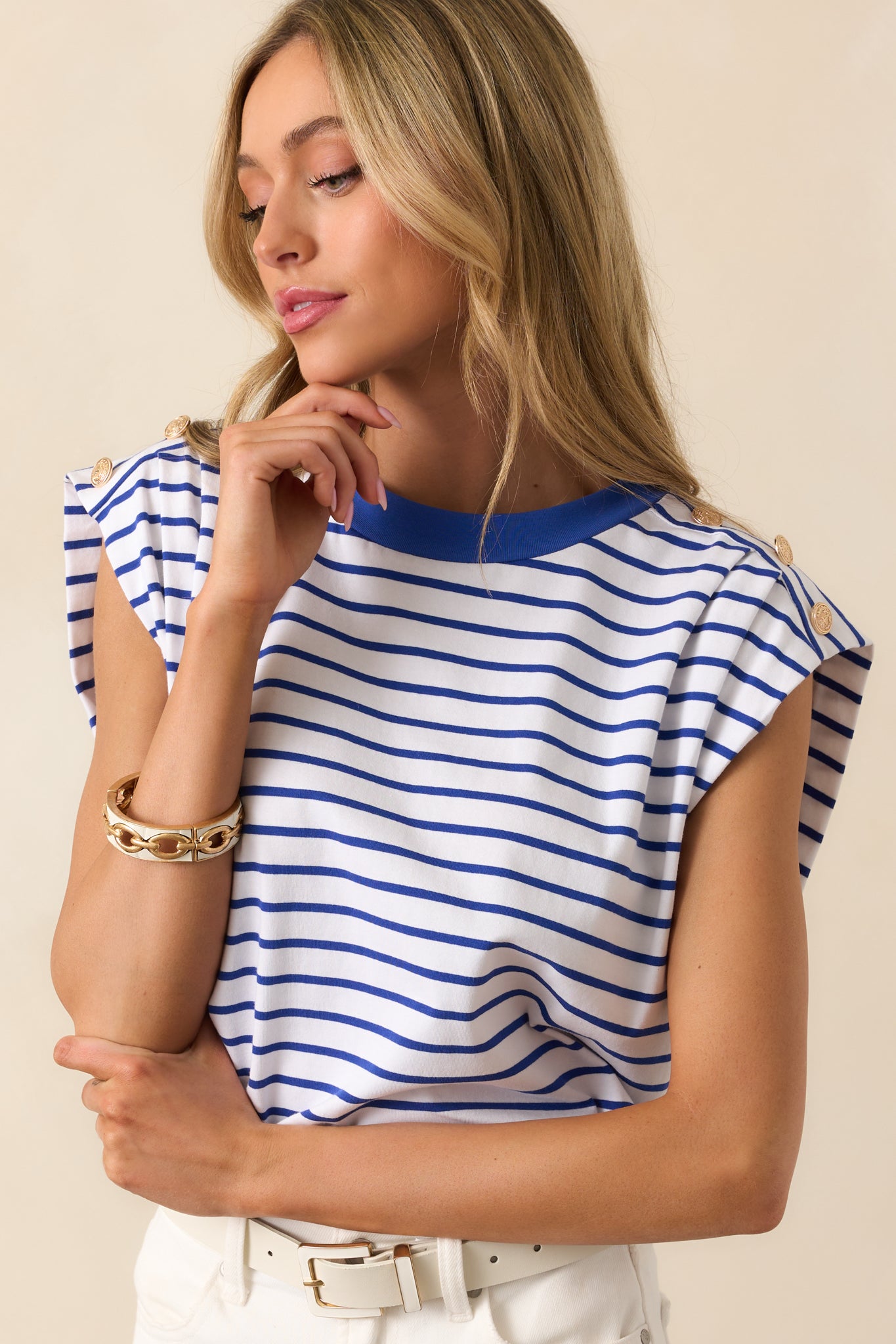 A close-up of the rounded neckline, focusing on the smooth fabric and stripe detail.