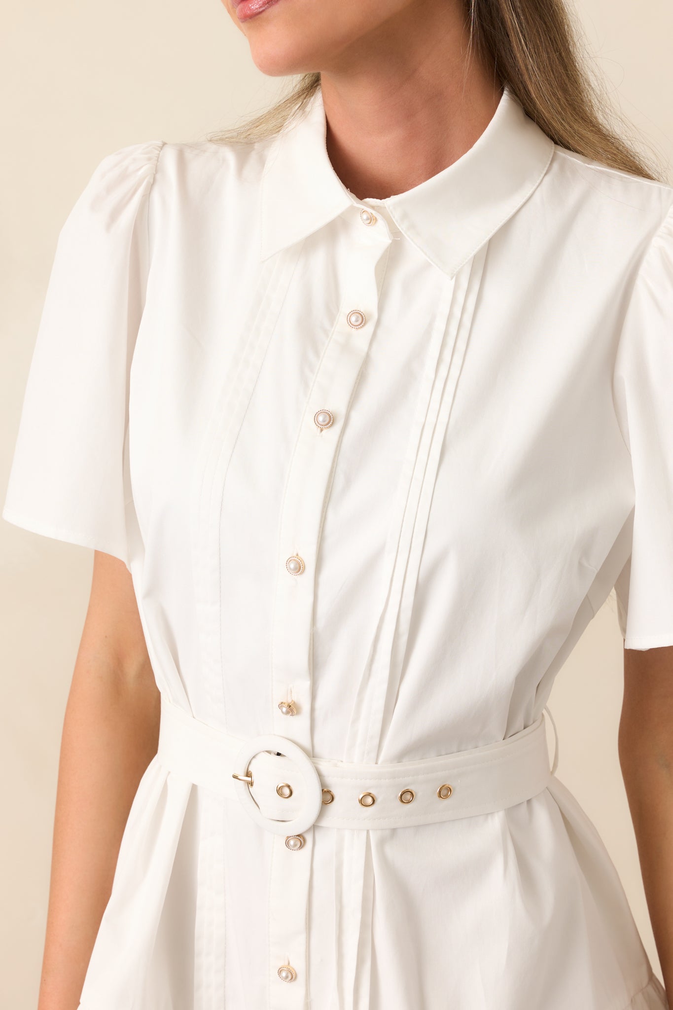 A zoomed-in look at the self-tie belt, highlighting its adjustable fit and added definition at the waist.