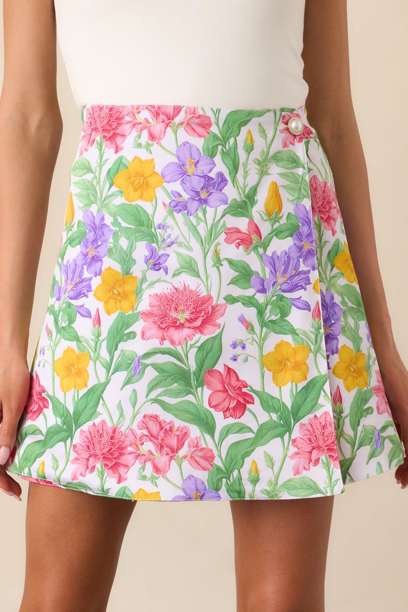 A detailed look at the exclusive Prosperina floral print, showcasing the intricate pattern and vibrant colors on one side of the reversible skirt.