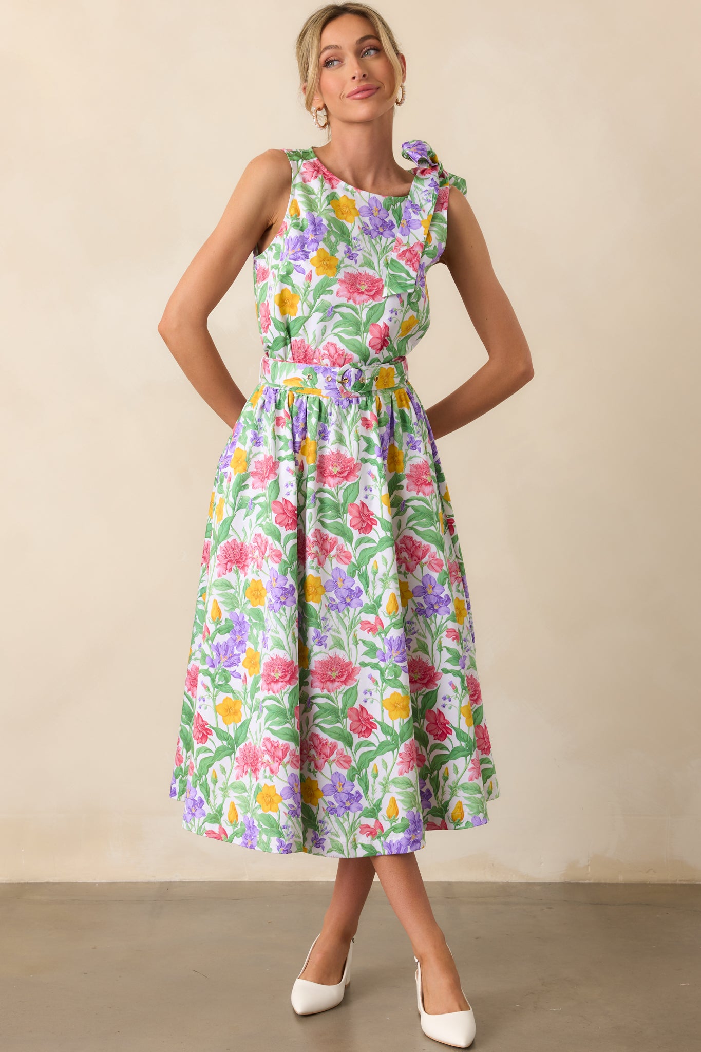Floral midi skirt with an eye-catching Prosperina print, functional pockets, and a stylish adjustable belt, offering a flattering A-line shape.