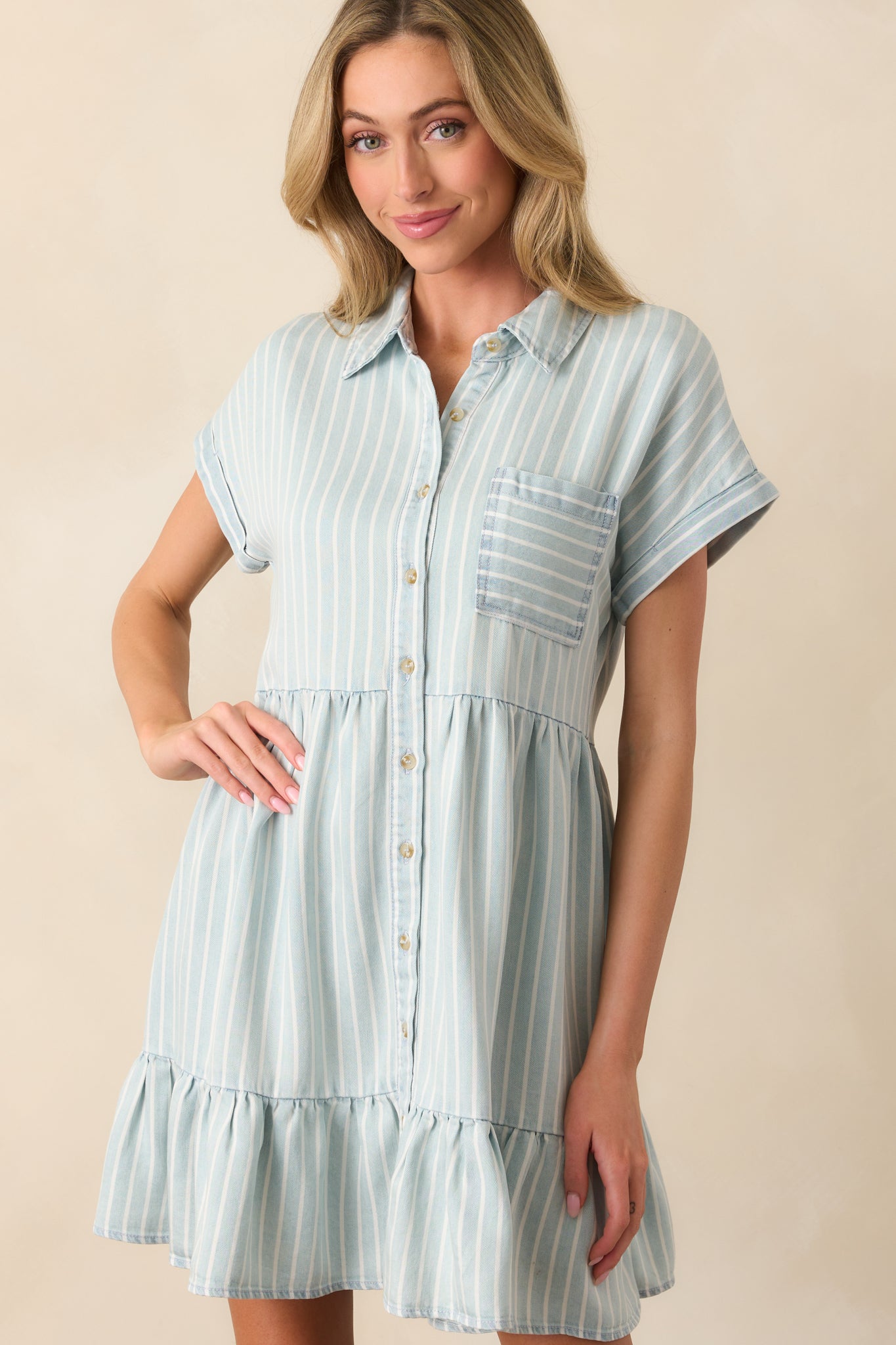 A detailed view of the chest pocket and vertical stripe pattern, showcasing the classic chambray texture.