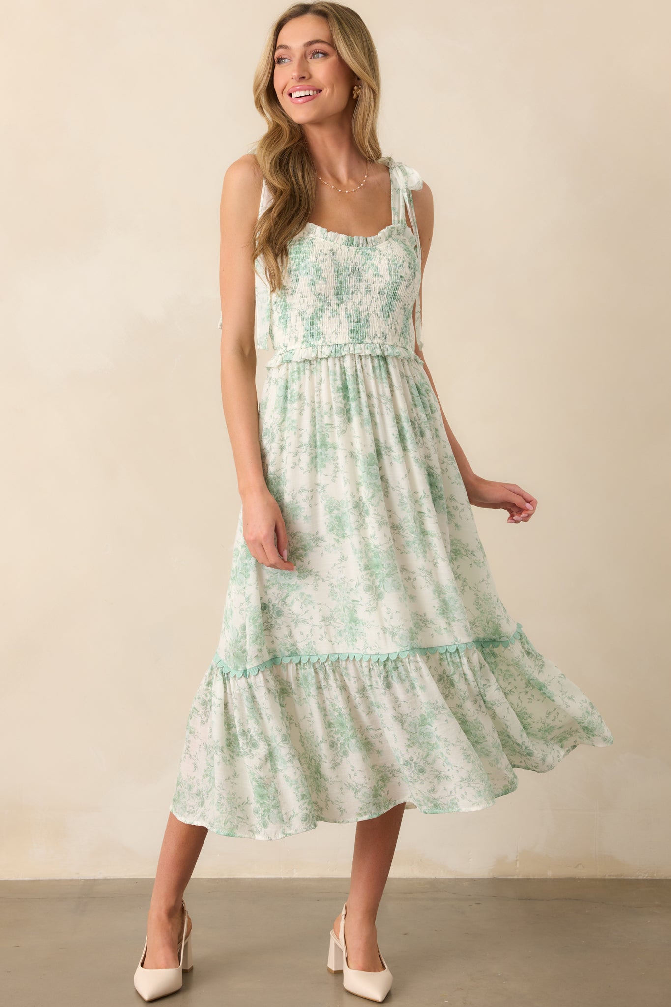 Light green toile floral dress with a sweetheart neckline and fully smocked bodice, shown in a front-facing full-length view.