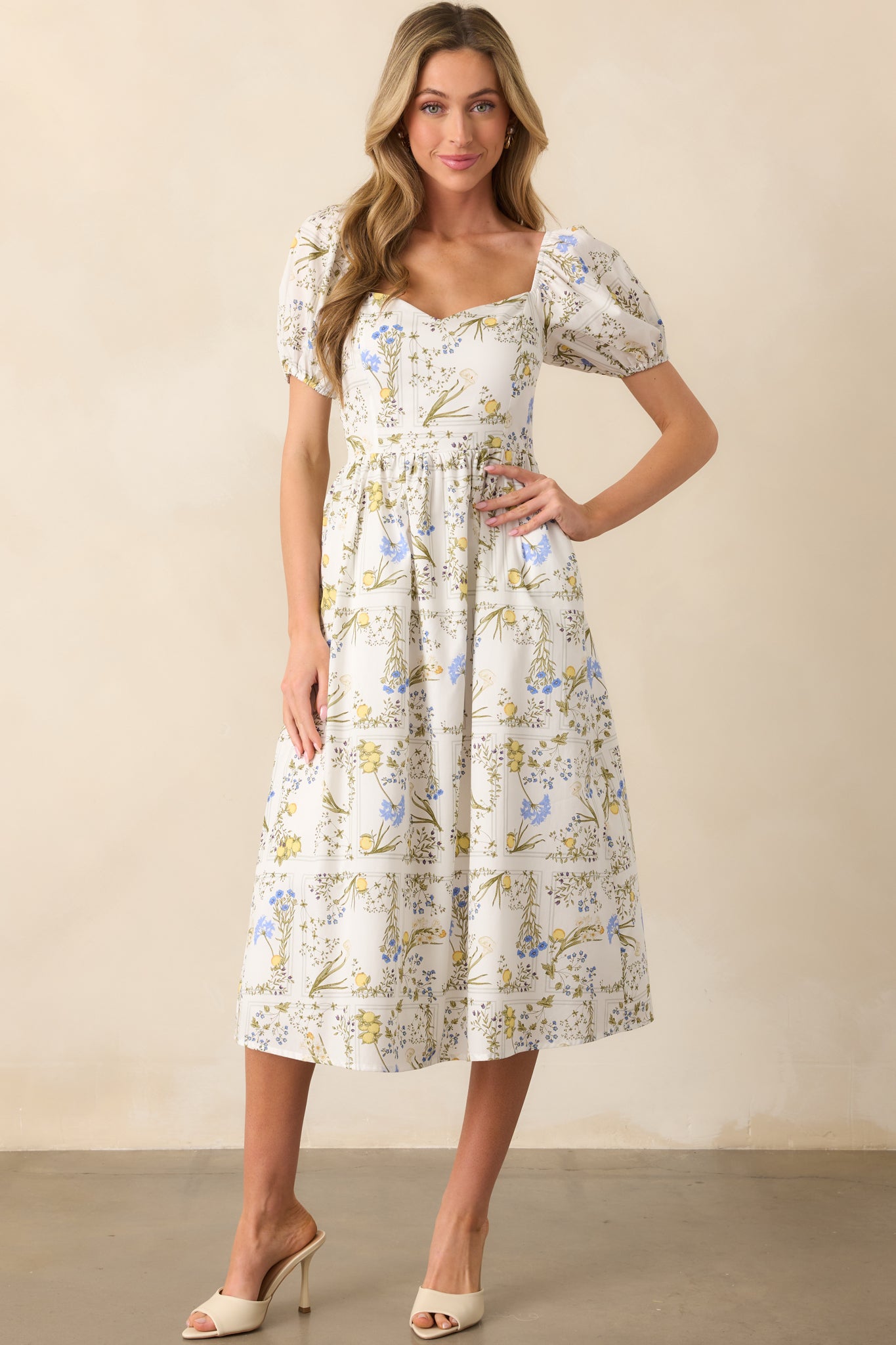 Lemon floral print midi dress captured front-on, emphasizing the hidden structure and soft drape of the fabric.