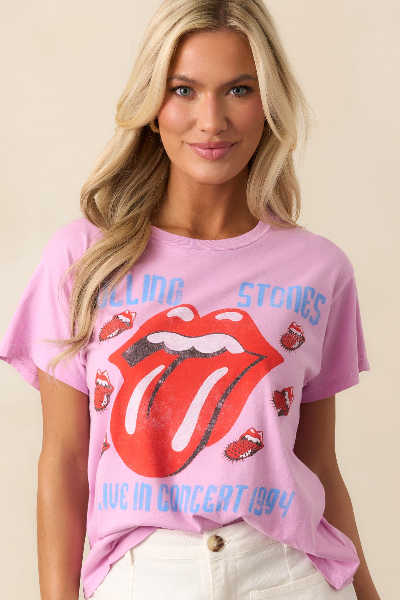 Detail of the crew neckline and upper chest portion of the tee, emphasizing the stitching and vivid graphic print.