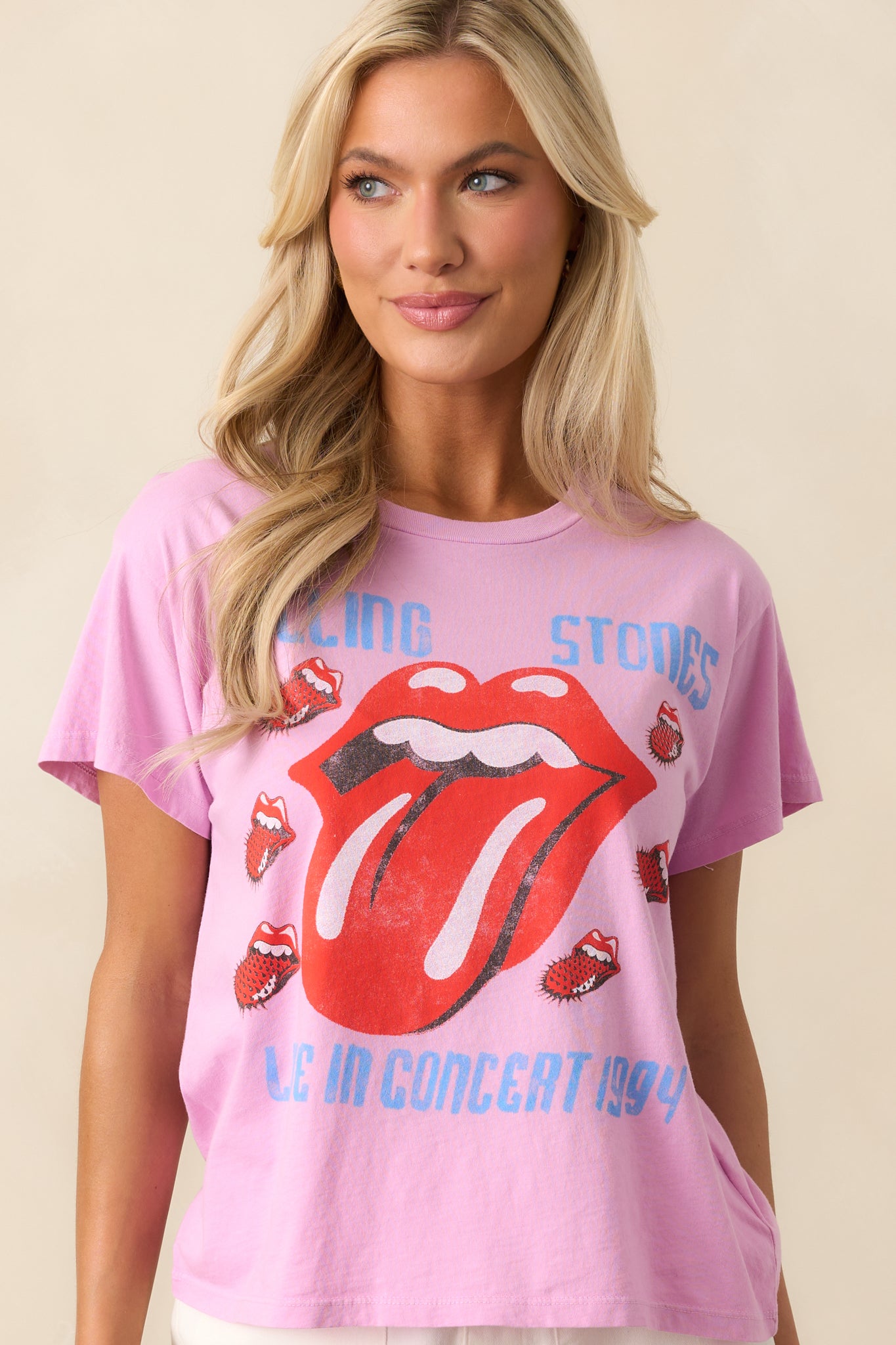 Zoomed-in view of the front lower half of the tee, showcasing the fabric texture and hemline against the graphic background.