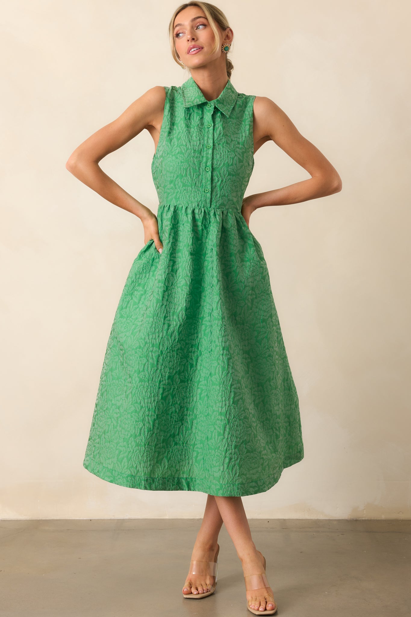 A tailored green midi dress with a hidden side zipper for a seamless and flattering fit.