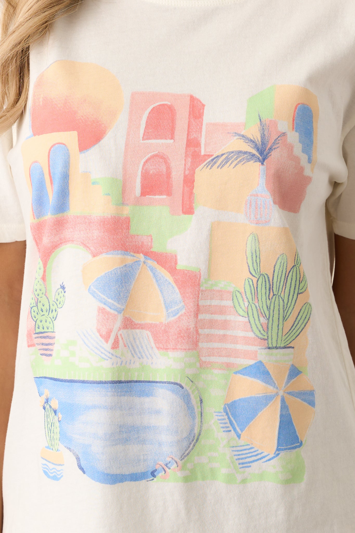 A close-up of the scenic beach graphic, highlighting the intricate design and vibrant colors on the soft ivory fabric.