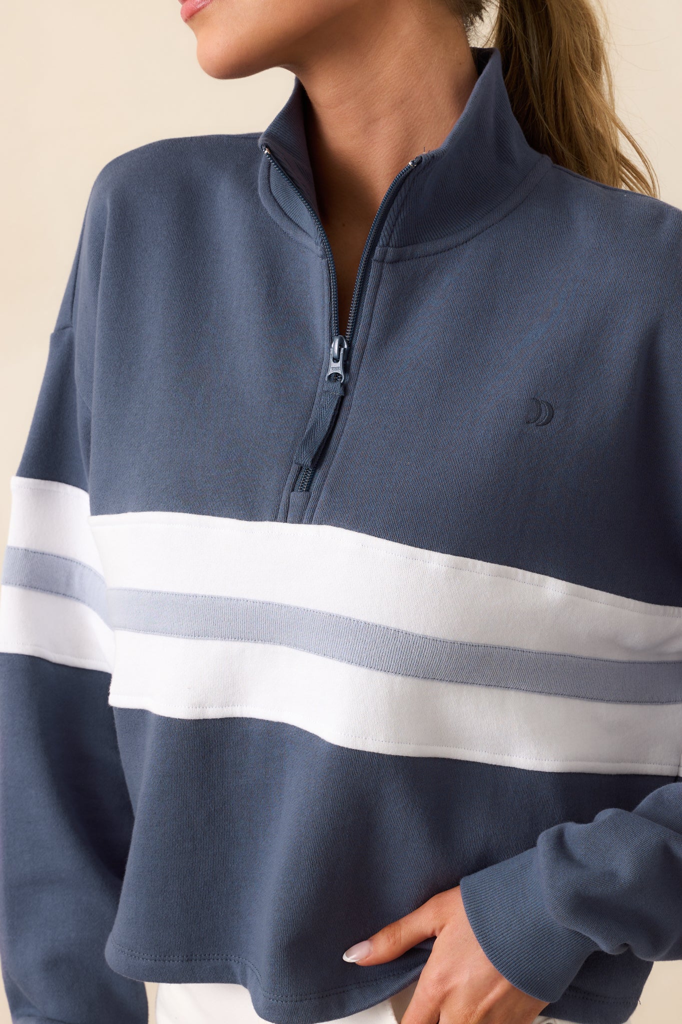 A zoomed-in look at the fabric texture and stitching, highlighting the sweatshirt’s worn-in feel and quality construction.