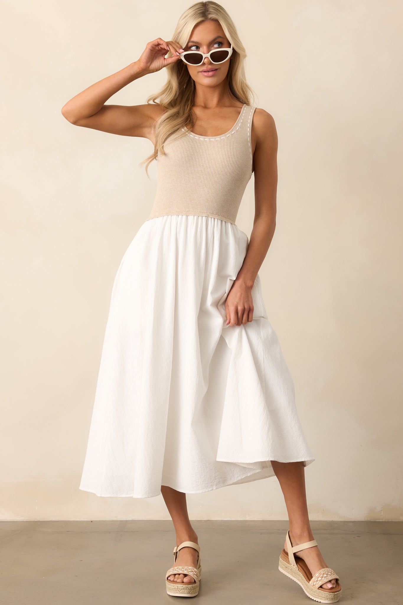 Ribbed knit midi dress featuring a tank top-style bodice with a scoop neckline, ivory blanket stitch trim detailing, and a white midi-length skirt with functional pockets.