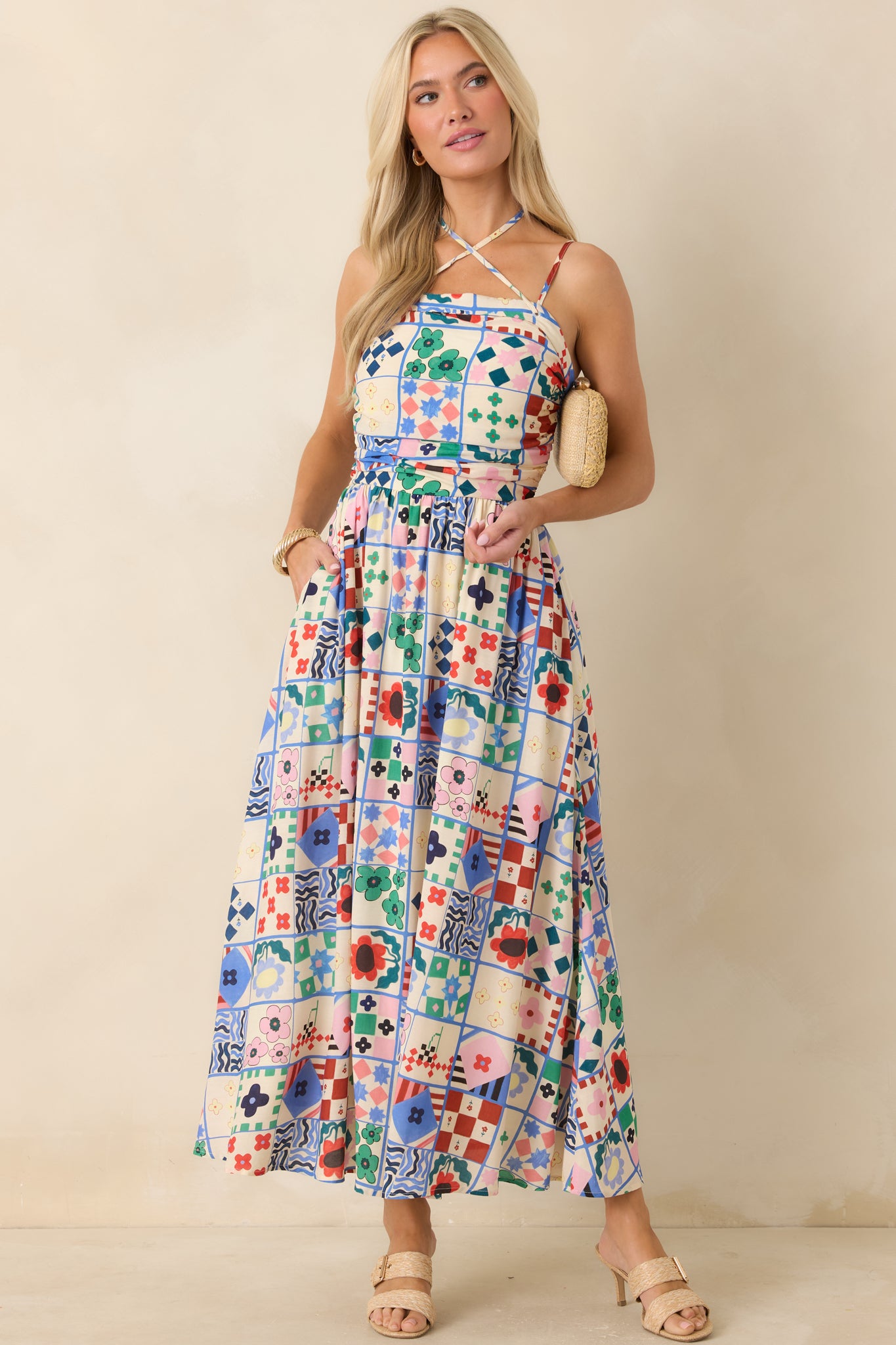 Color-block floral maxi dress with sculpted bodice and fluid skirt movement.