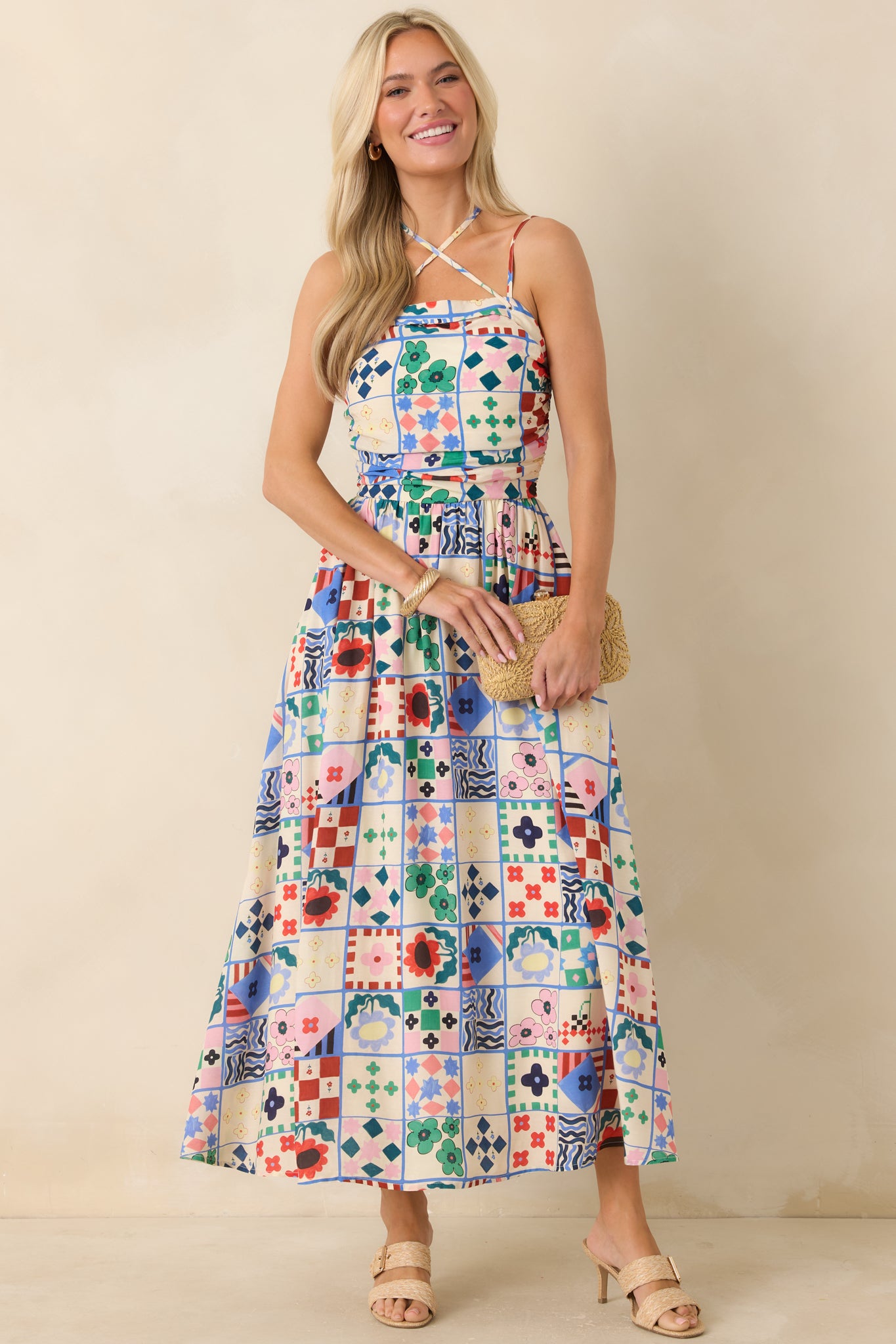 Patterned maxi dress with adjustable tie straps and relaxed, practical pockets.