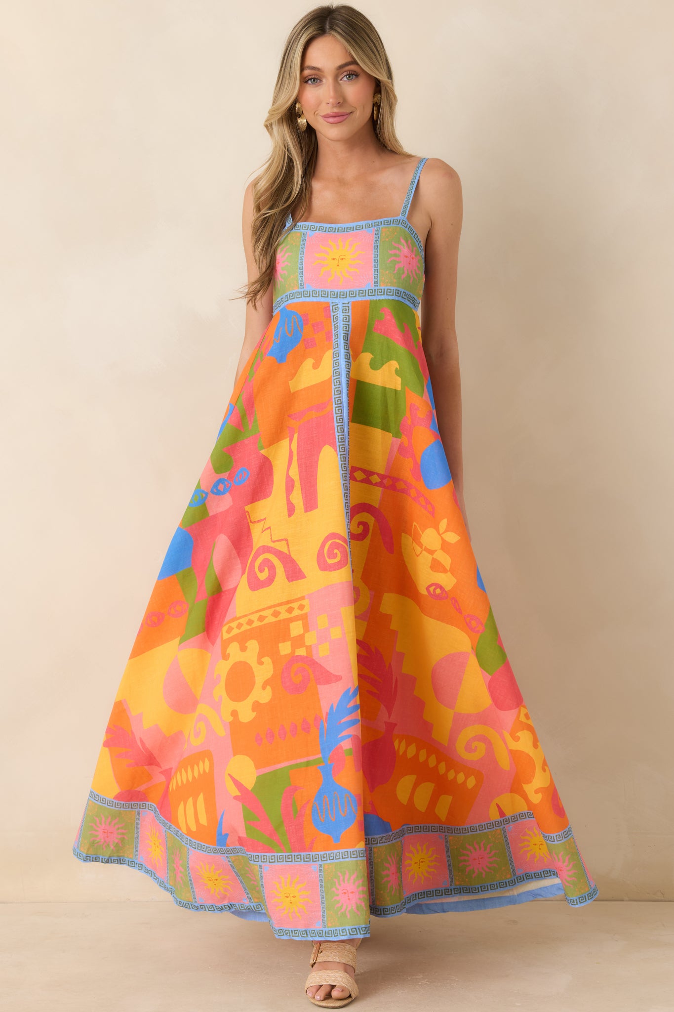 Cotton poplin maxi dress with adjustable straps and bold contrast border detailing.