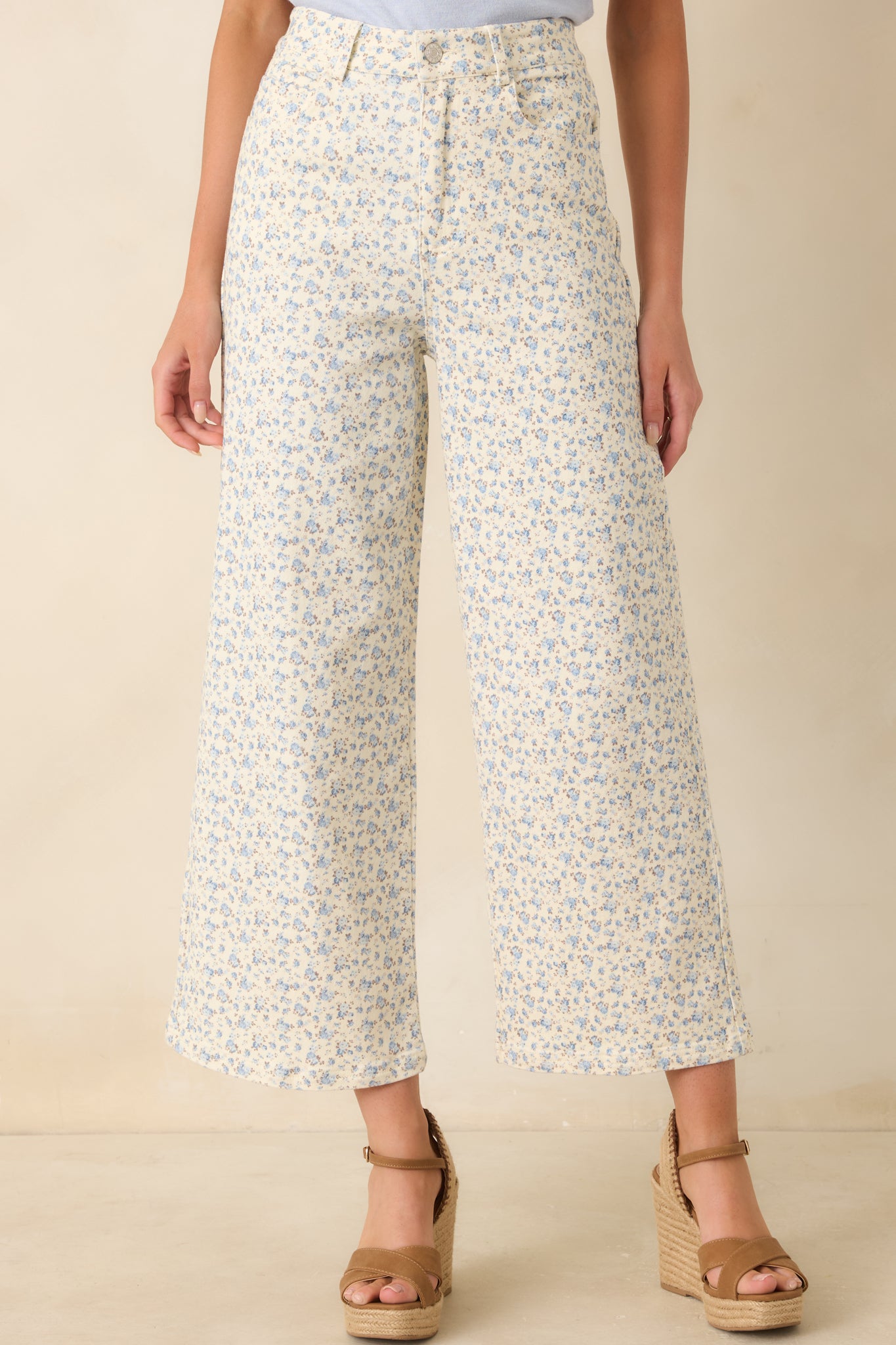 Detailed focus on the blue floral print pattern distributed across the denim fabric.
