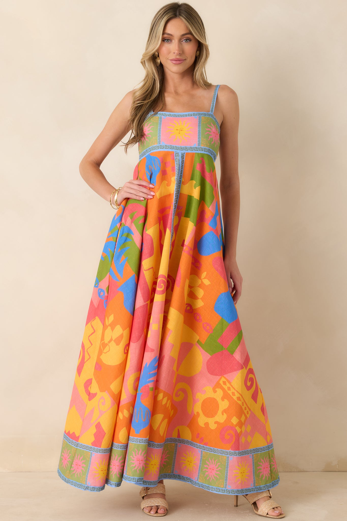 Structured abstract print maxi dress with flowing skirt and tailored bodice.