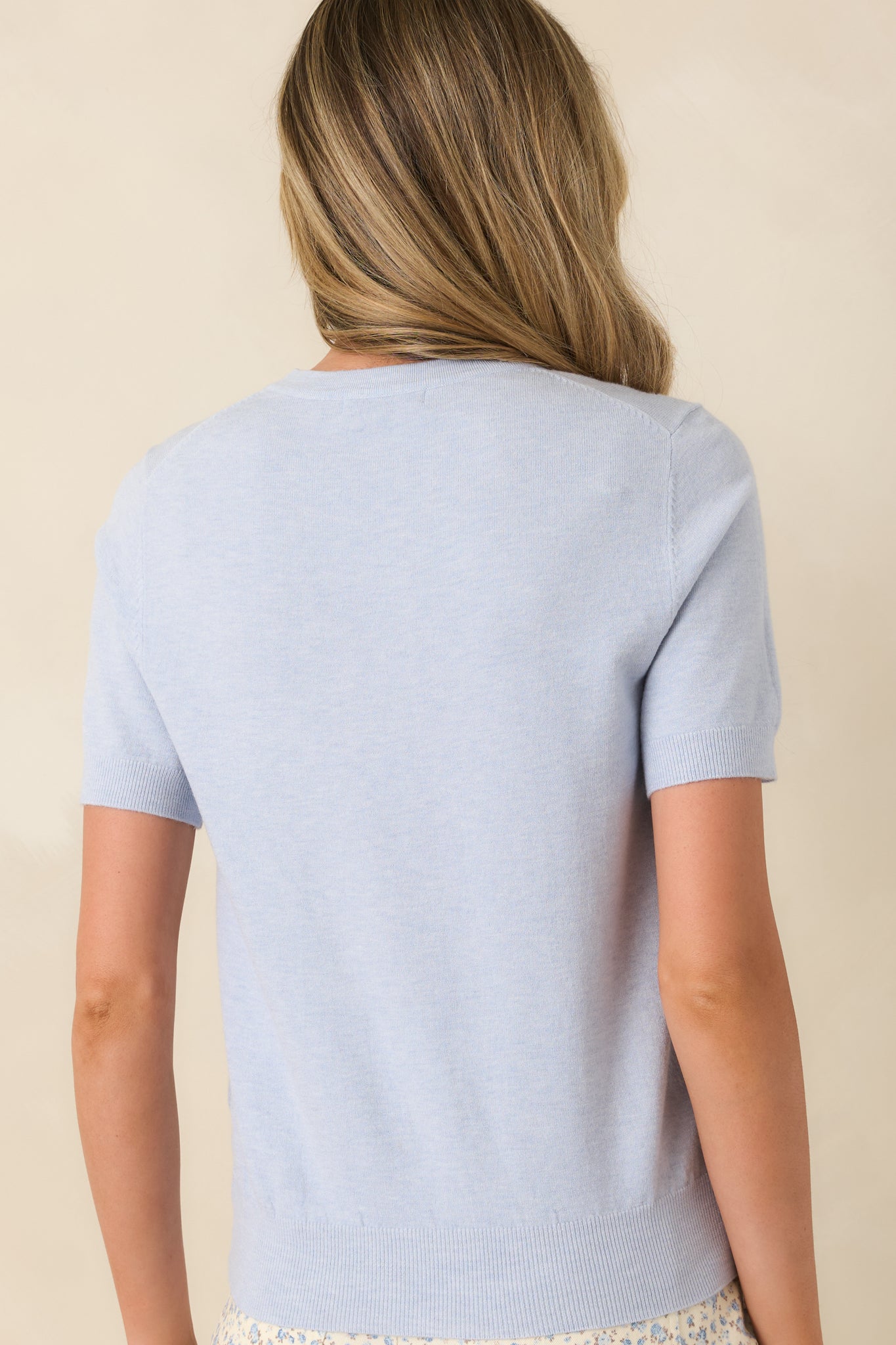 Rear view of classic short sleeve tee with crew neckline and streamlined silhouette.