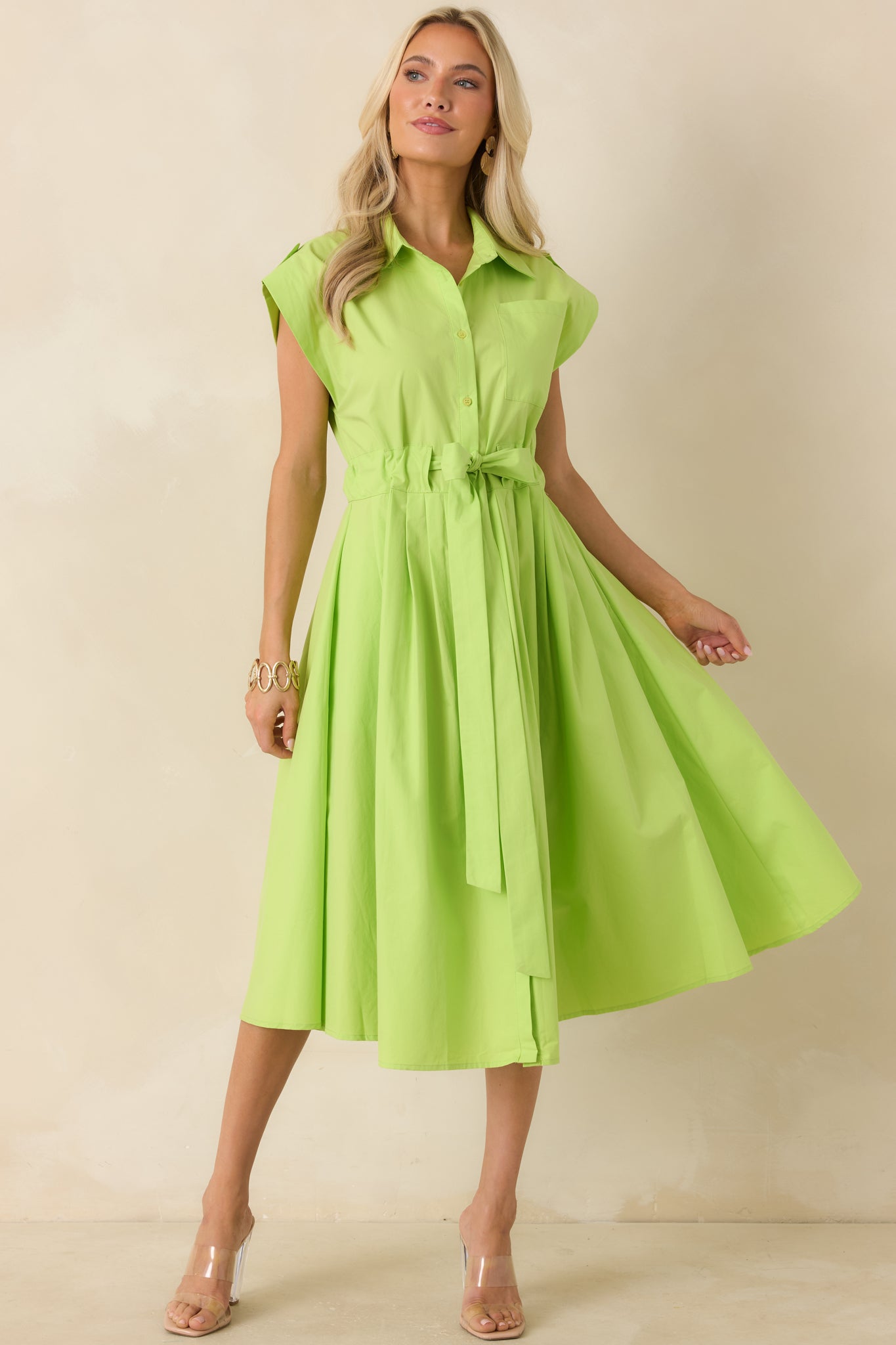 Lime green cotton midi dress featuring a collared neckline, cap sleeves, and a structured button-front bodice.