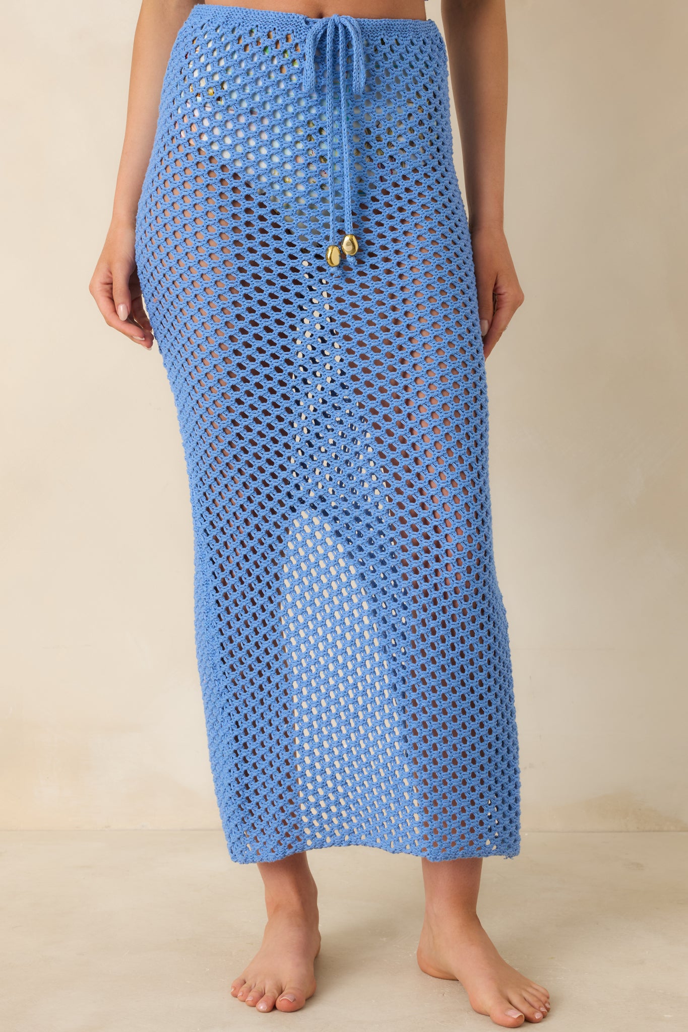 Cropped view focusing on gold-tone bead-accented drawstring and comfortable hip sit of the skirt.