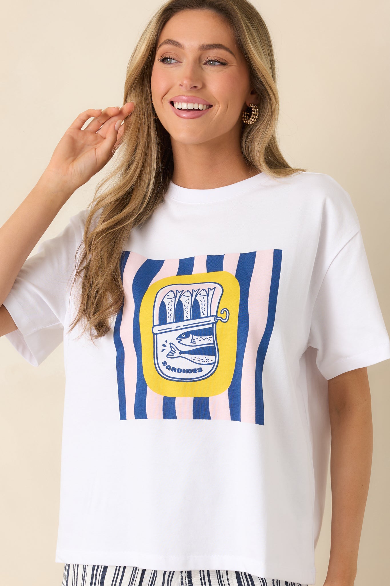 Cropped view highlighting whimsical sardine tin motif and striped graphic detailing.