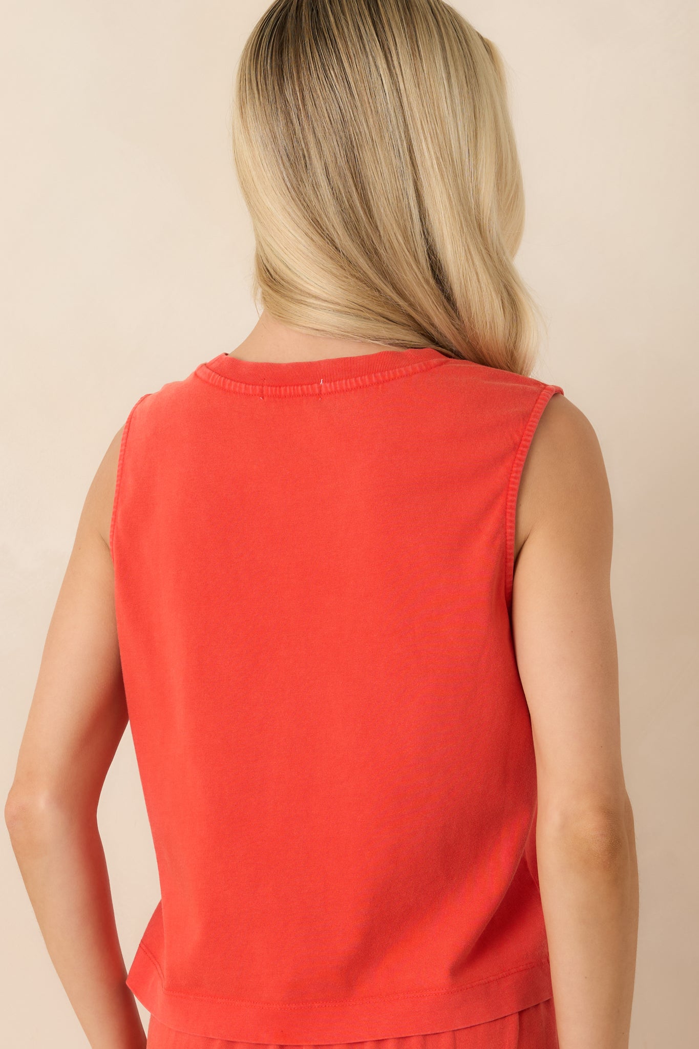 Rear view of the poppy red cotton jersey tank featuring the sleeveless relaxed silhouette and soft lightweight fabric.