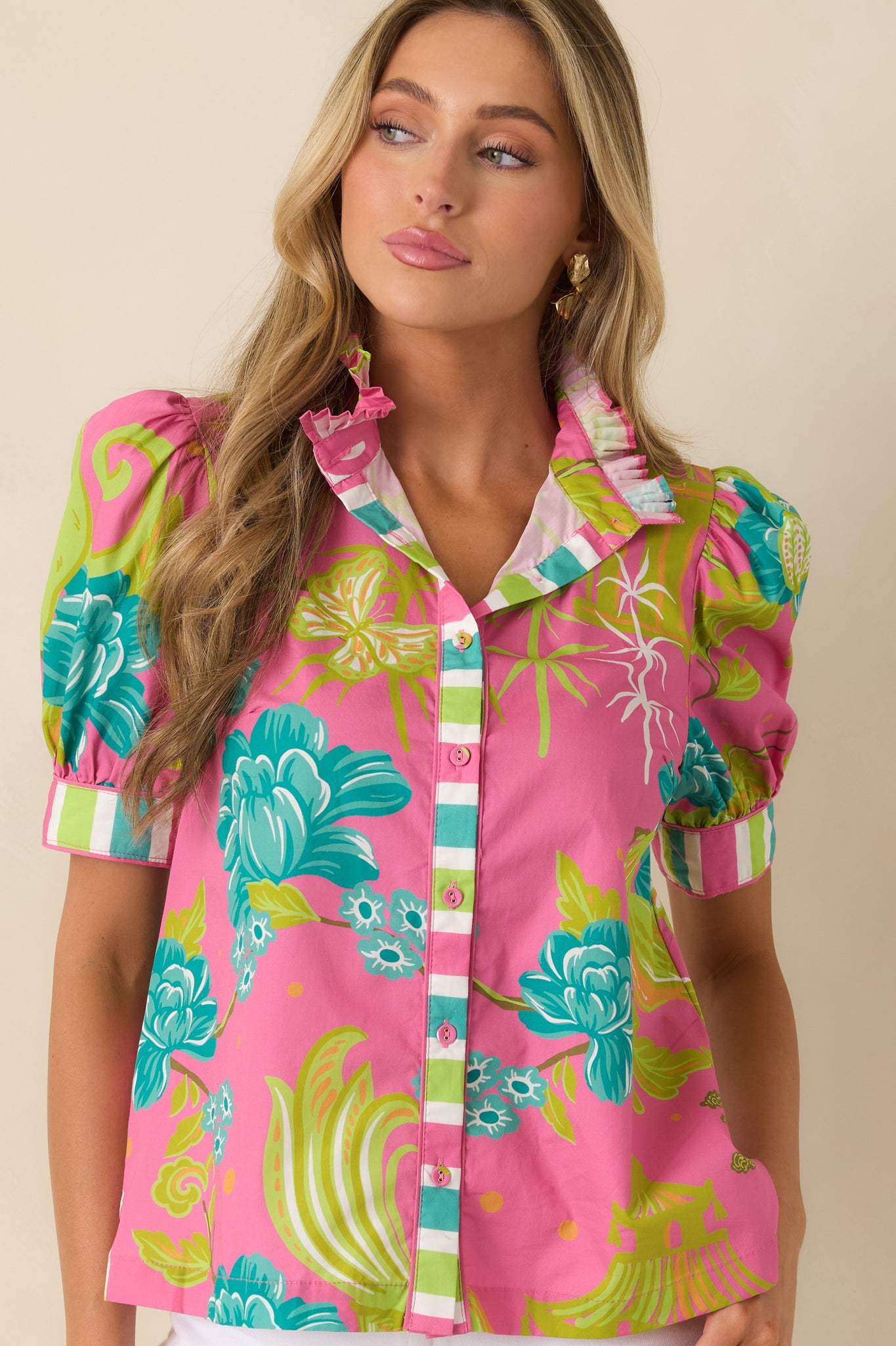 Cropped detail of puff sleeves showing striped cuff accents and gathered sleeve volume.