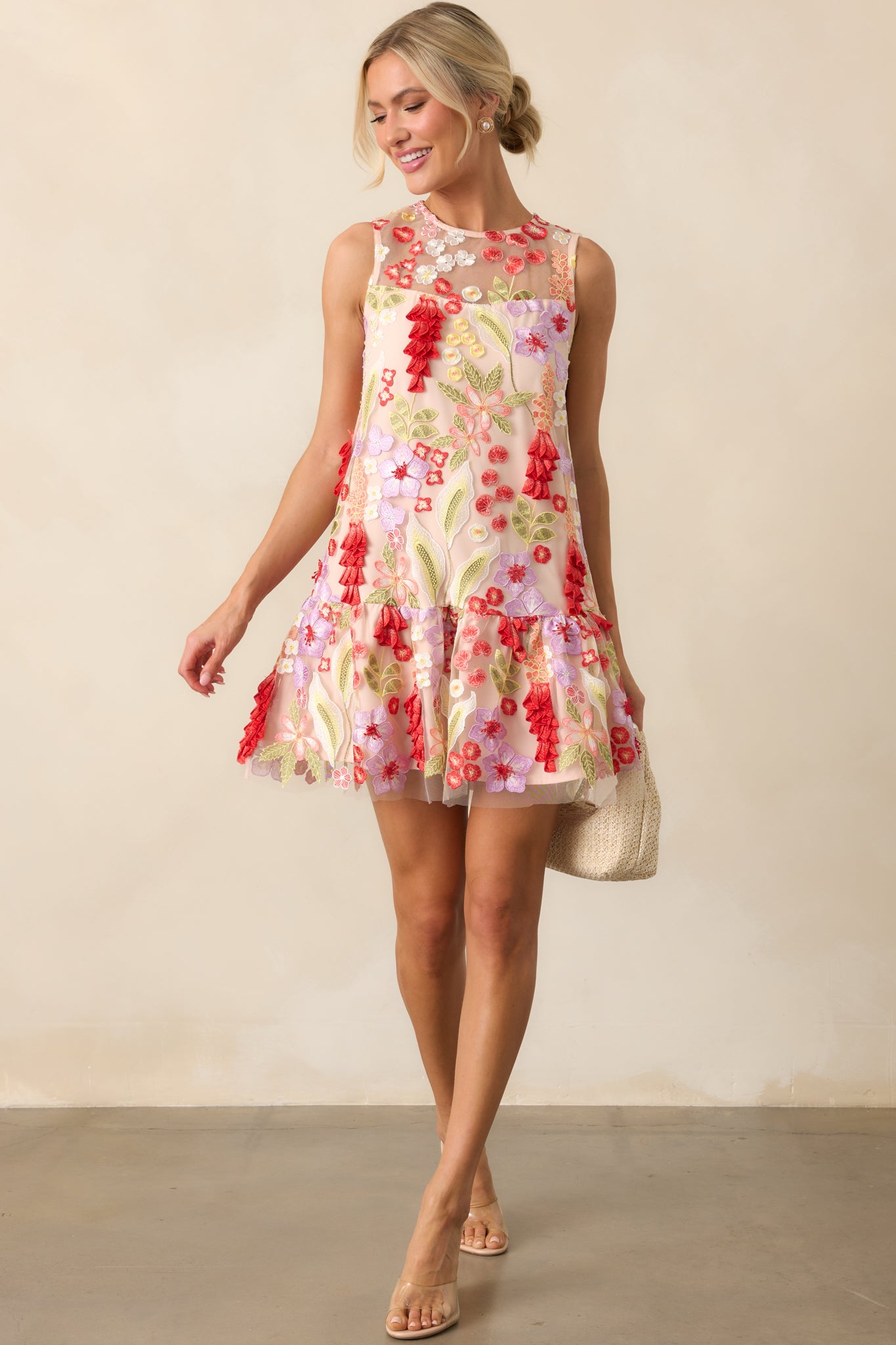 Front-facing view of the mini dress, showcasing the textured 3D floral embroidery across the mesh overlay.