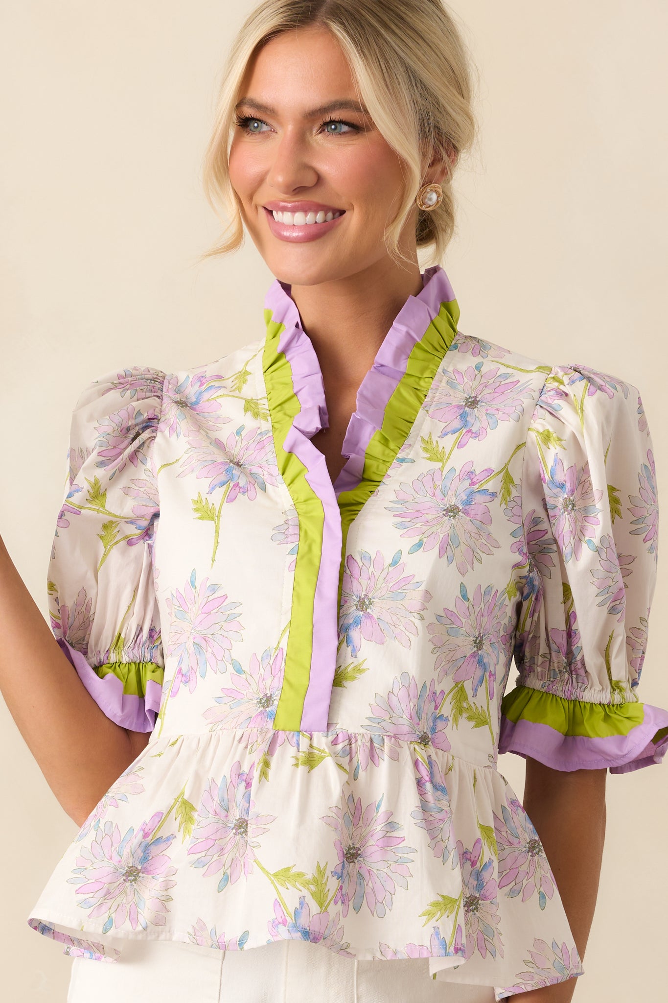 Zoomed-in angle of the puff sleeve with elastic ruffle cuff, emphasizing sleeve structure and print detail.