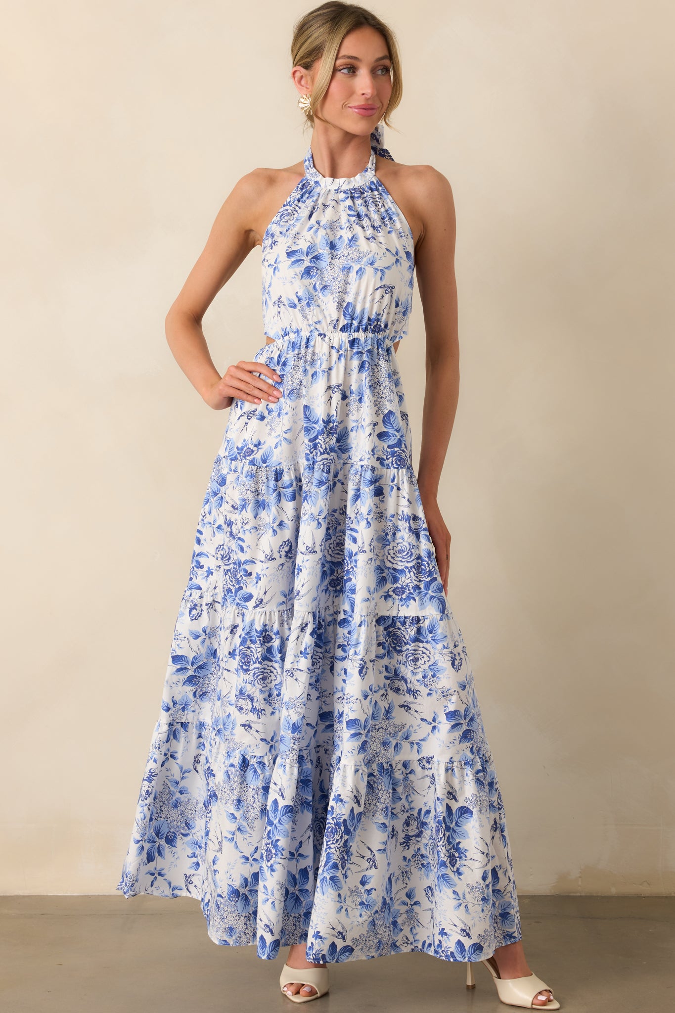 Front angle of the maxi dress featuring the self-tie halter neckline and soft floral print, emphasizing the elegant, bohemian feel.
