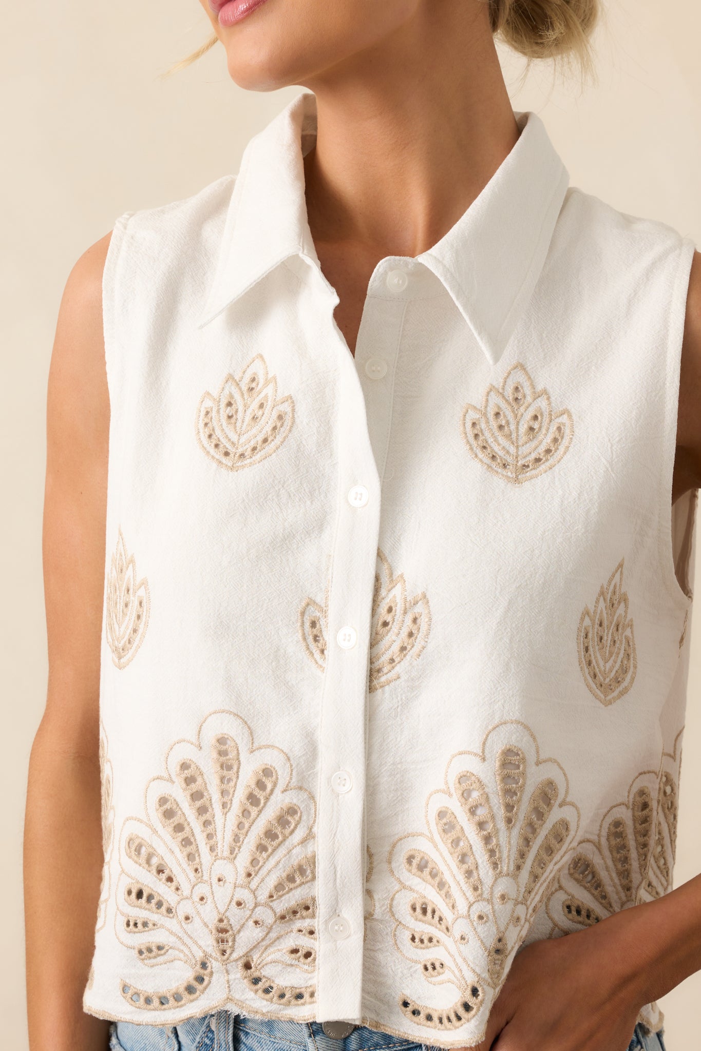 Close-up image of the eyelet lace embroidery and scalloped trim, highlighting the delicate stitching.