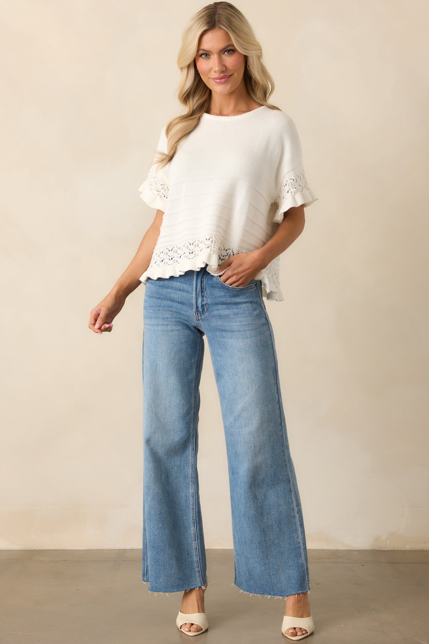 Lightweight ivory shirt featuring ruffle hems and an open knit trim, displayed in a full length shot to show overall silhouette.