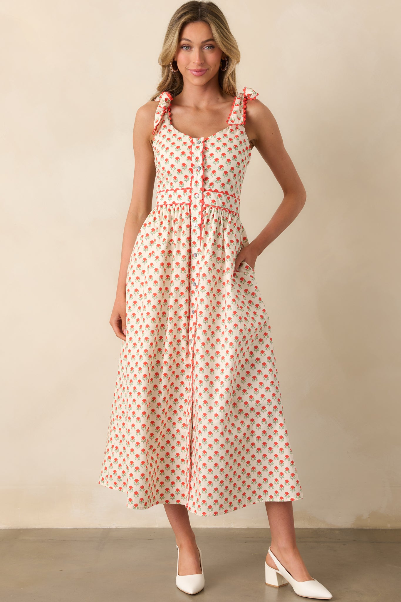 Red floral maxi dress with a scoop neckline and button-down front, shown in a standing front-facing view.