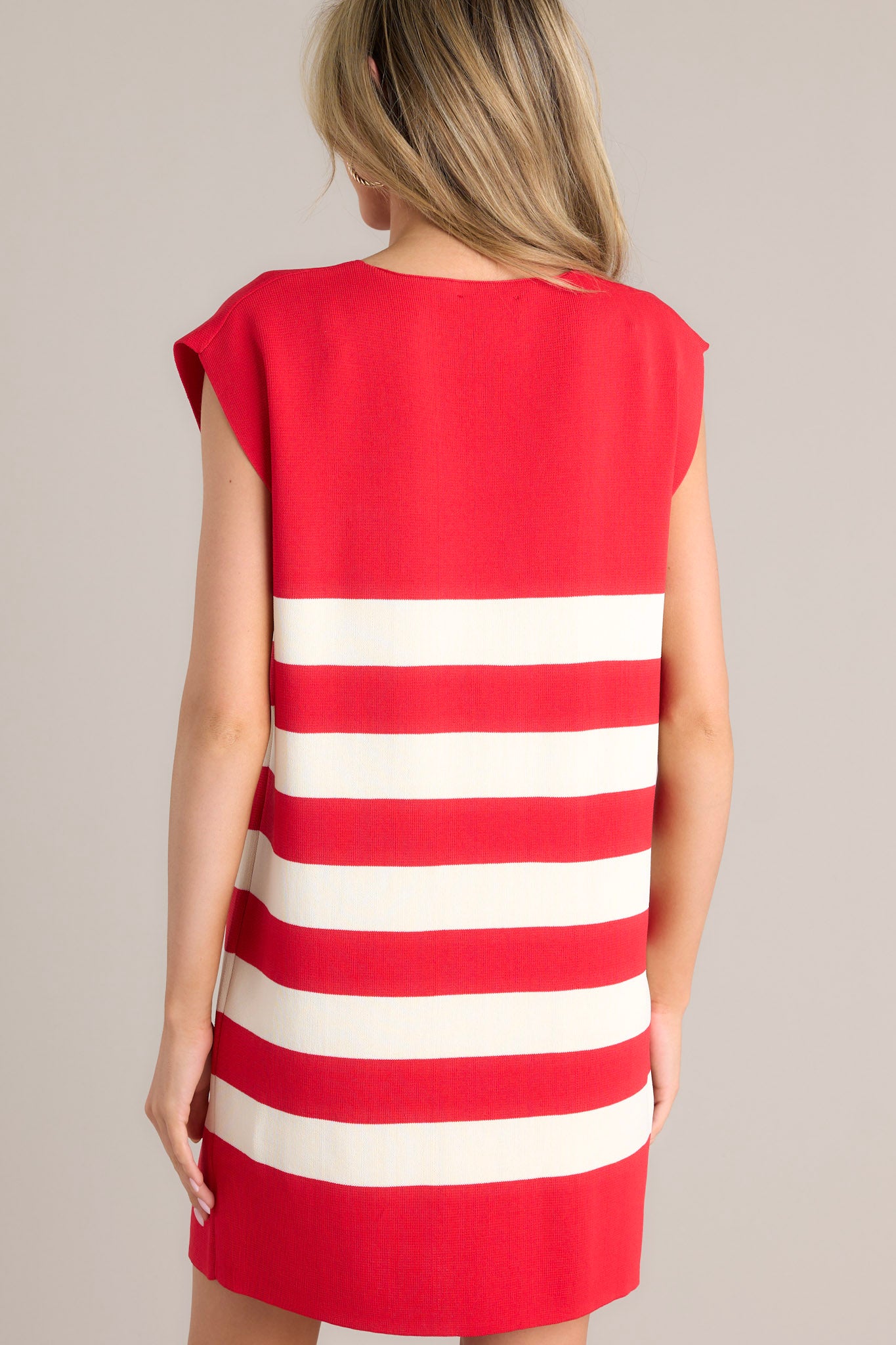 Back view of this red dress that features