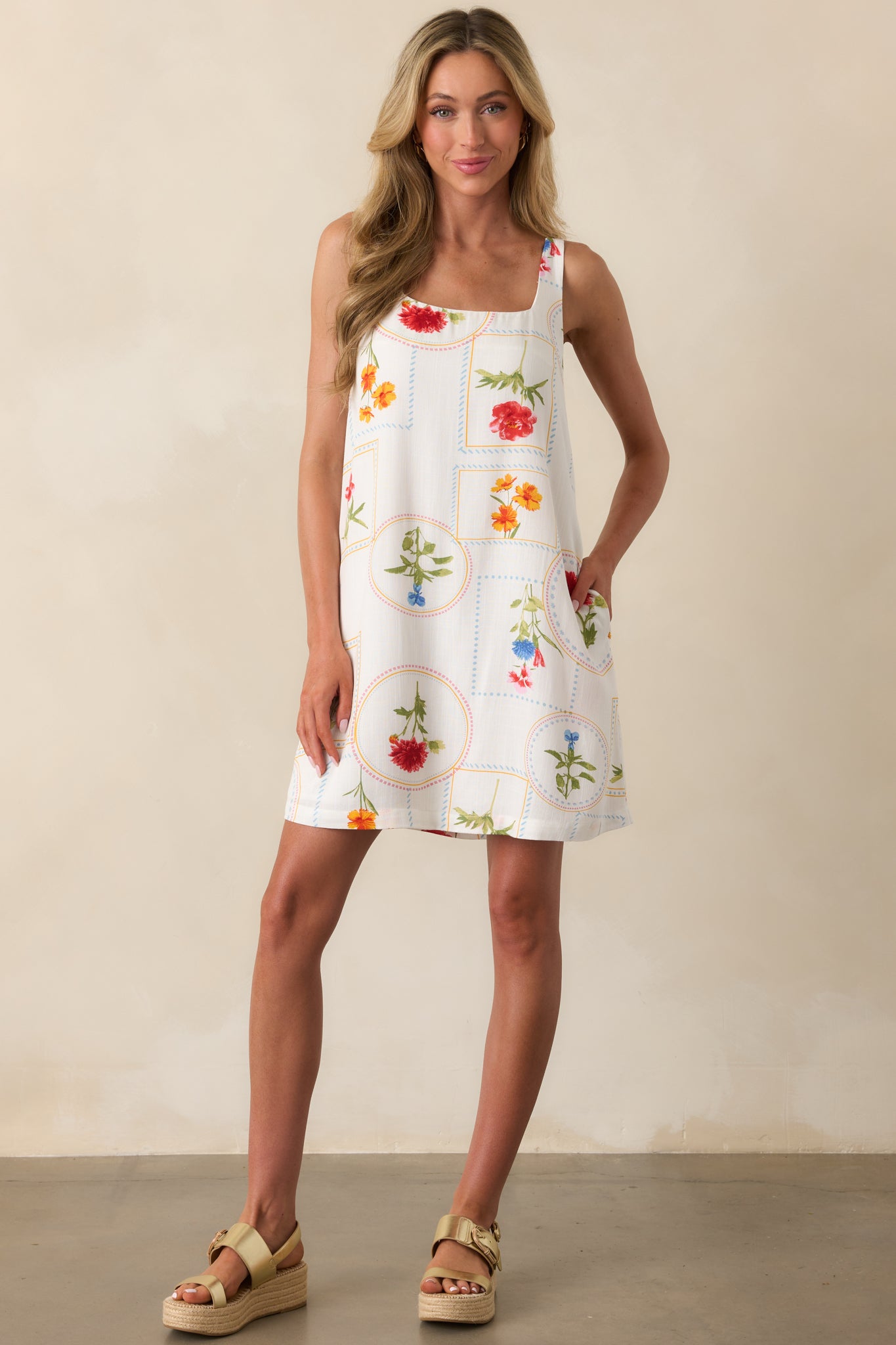 Full-length view of an ivory dress with self-tie back closure and back elastic waist insert, showcasing the lightweight structure.