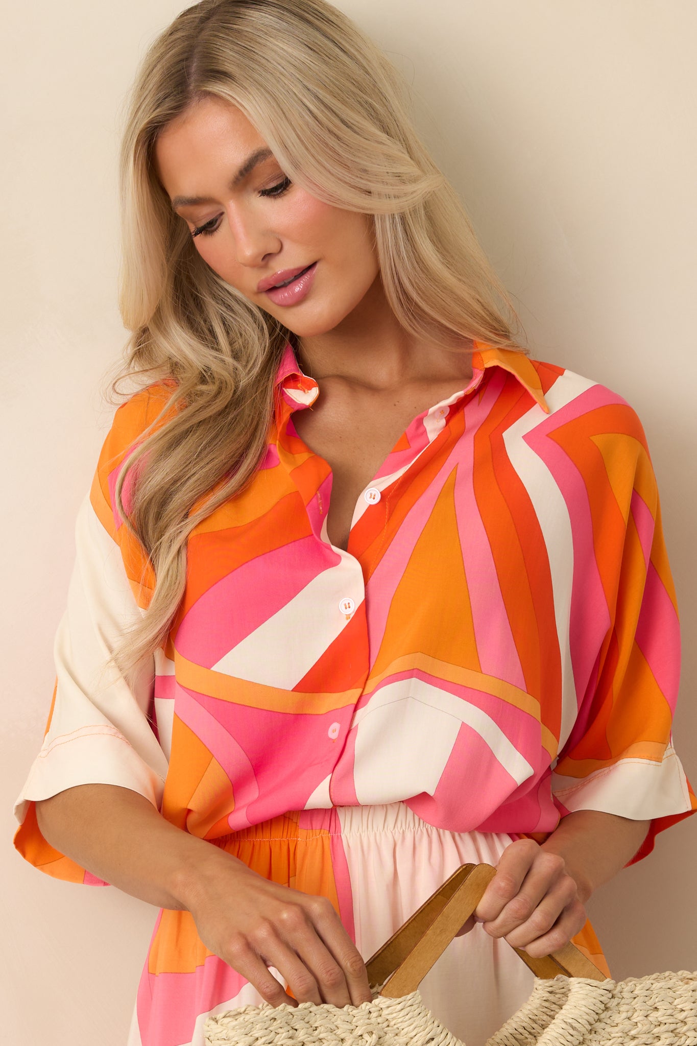 Cropped view focusing on the collared neckline and upper portion of the multicolor printed top.
