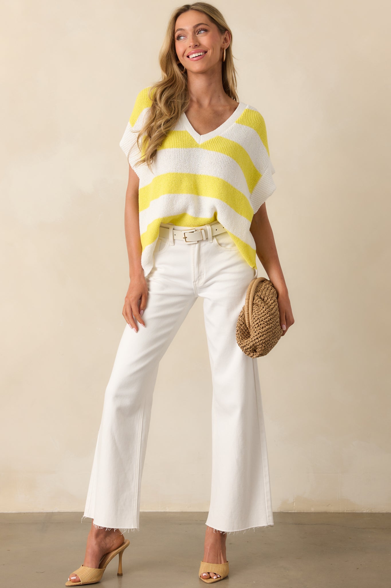 Full-body image of the striped knit top showcasing its oversized fit and breezy silhouette.