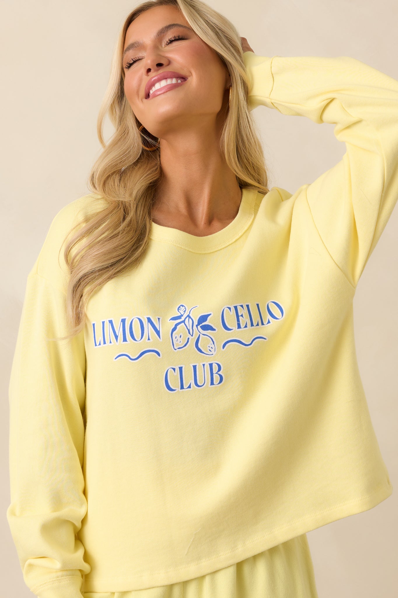 Midsection crop highlighting the ribbed hem and soft texture of the lemonade yellow fabric.