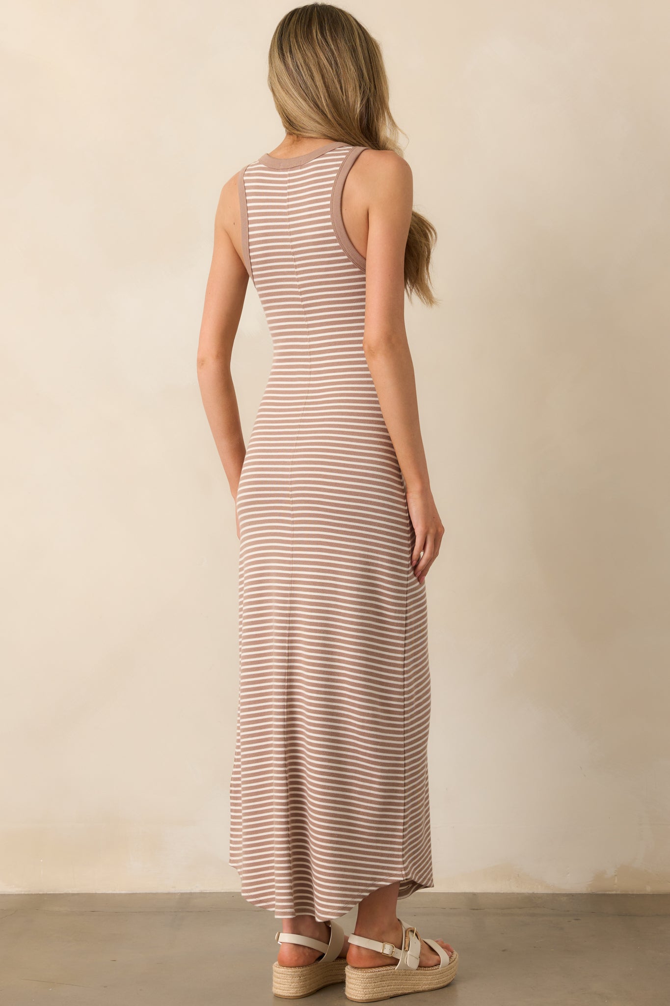 Back view of the tan iced coffee midi dress, displaying the visible back seam, bodycon fit, and ribbed fabric.