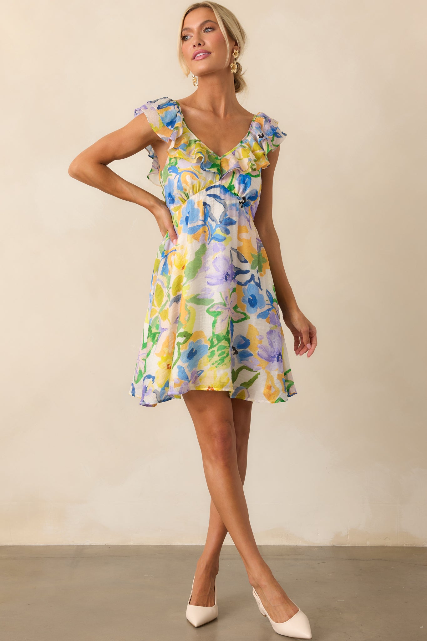 Front-facing image of yellow dress showing the playful frill sleeve design and flattering silhouette.