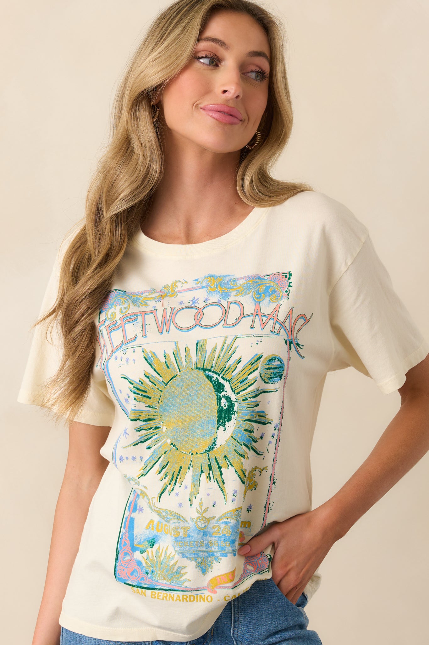 A close-up shot of the upper section of the tee, showing the ribbed crew neckline and partial view of the celestial artwork.