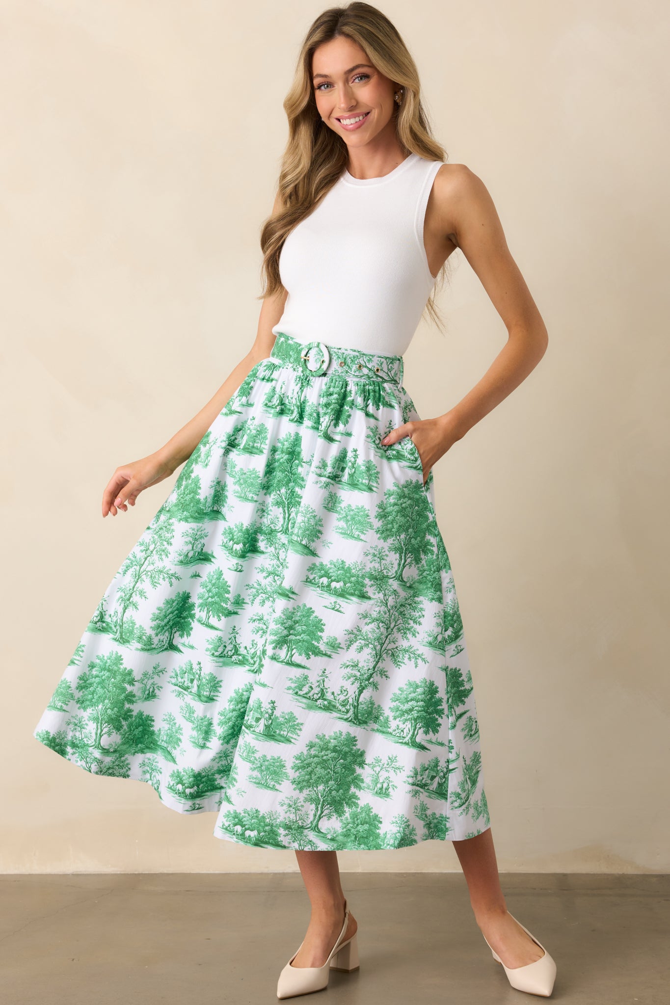 A full-length shot capturing the full hemline, soft pleating, and even flow of the toile print design.