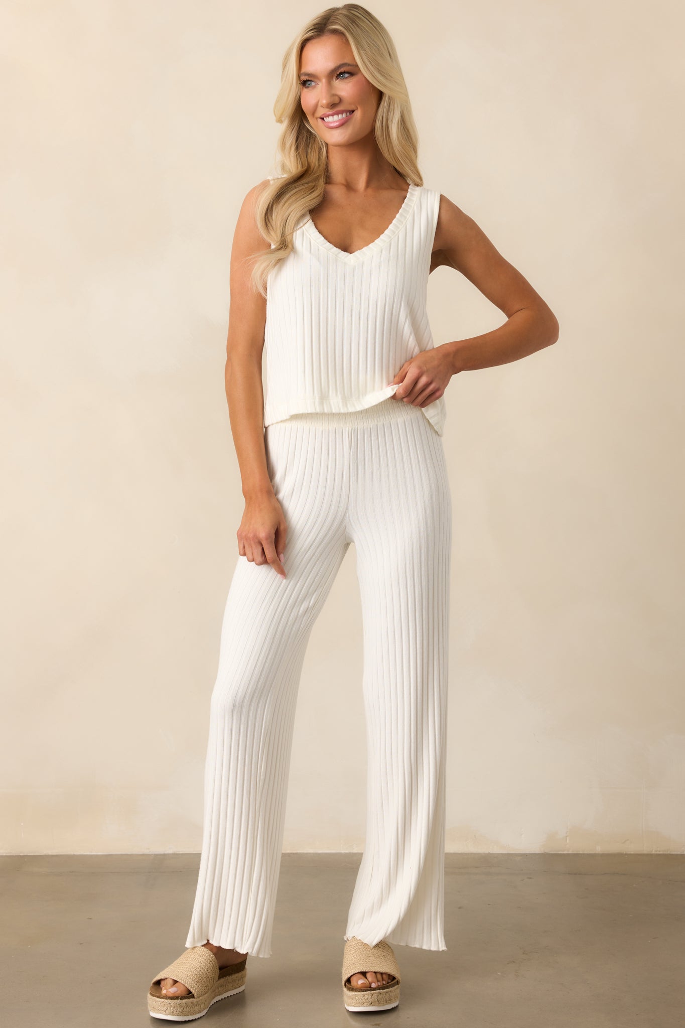 A complete look featuring the ivory v-neck top with subtle vertical ribbing and a flattering sleeveless cut.