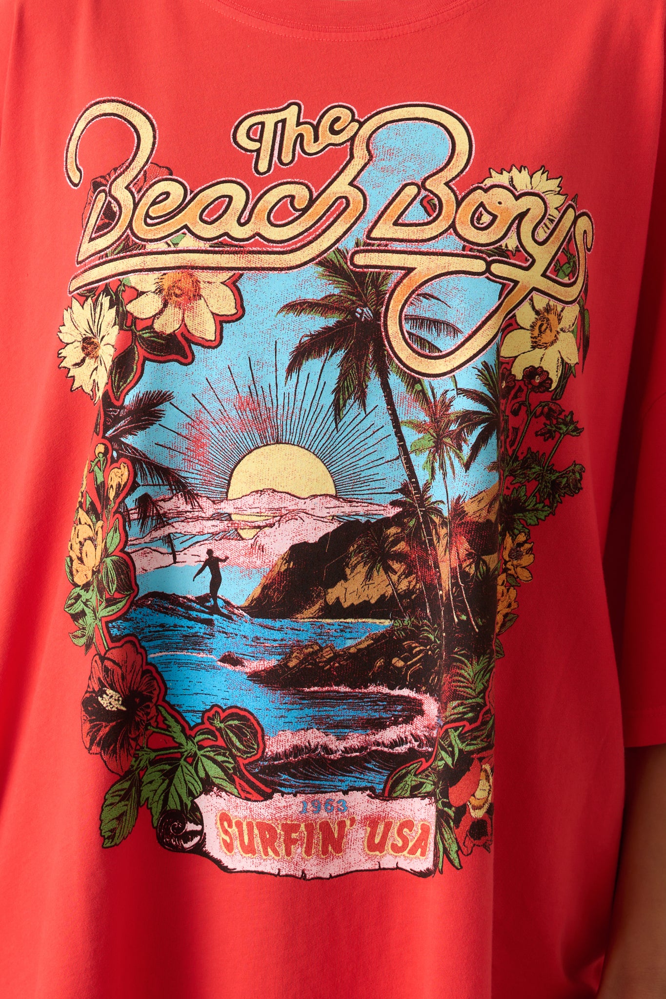 Close-up of the tee’s cotton fabric and printed graphic texture showing fine design elements.