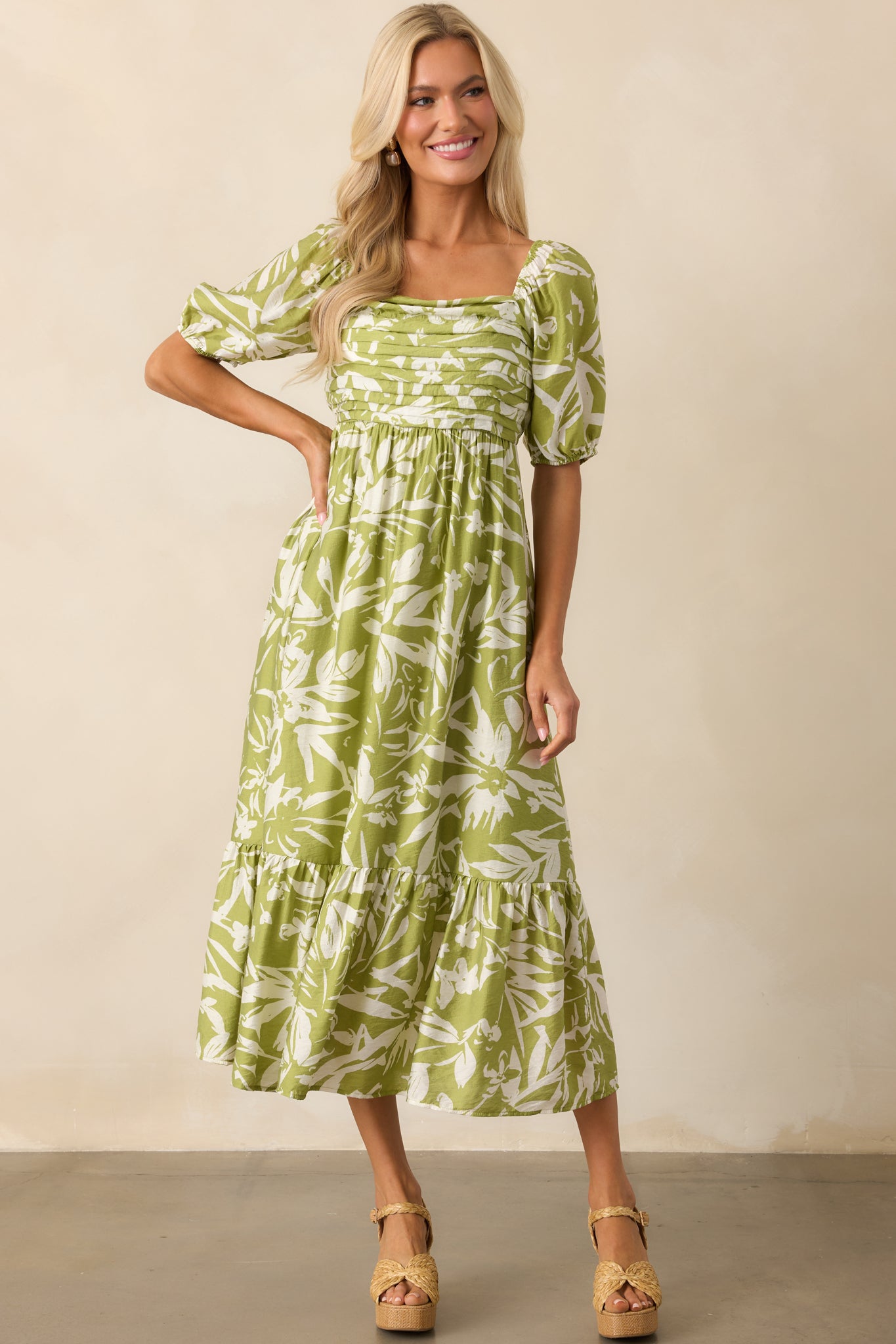 Full length view of the dress showing the all over ivory floral print and relaxed fit.