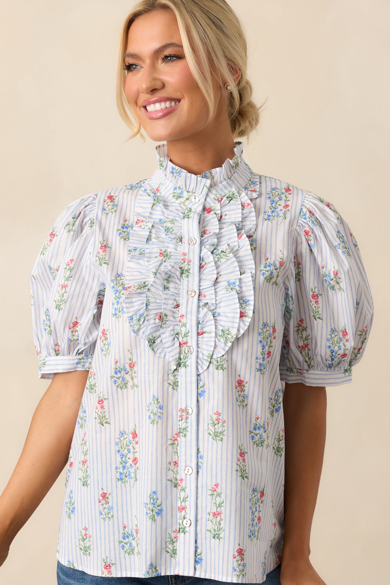 Cropped shot centered on the bust area, showing the vertical frill detailing and button front closure.