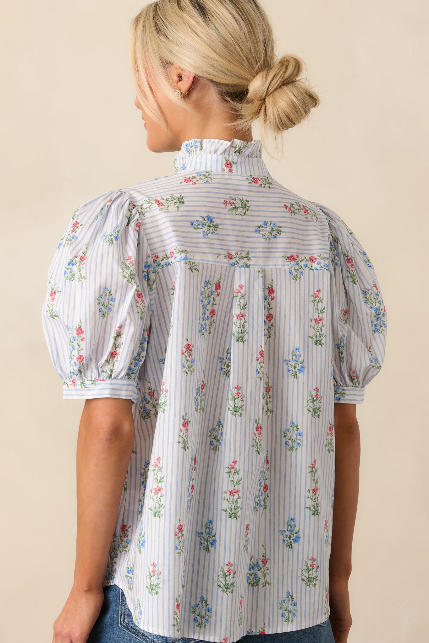 Rear view of the top revealing the relaxed fit and subtle gathering along the back neckline.
