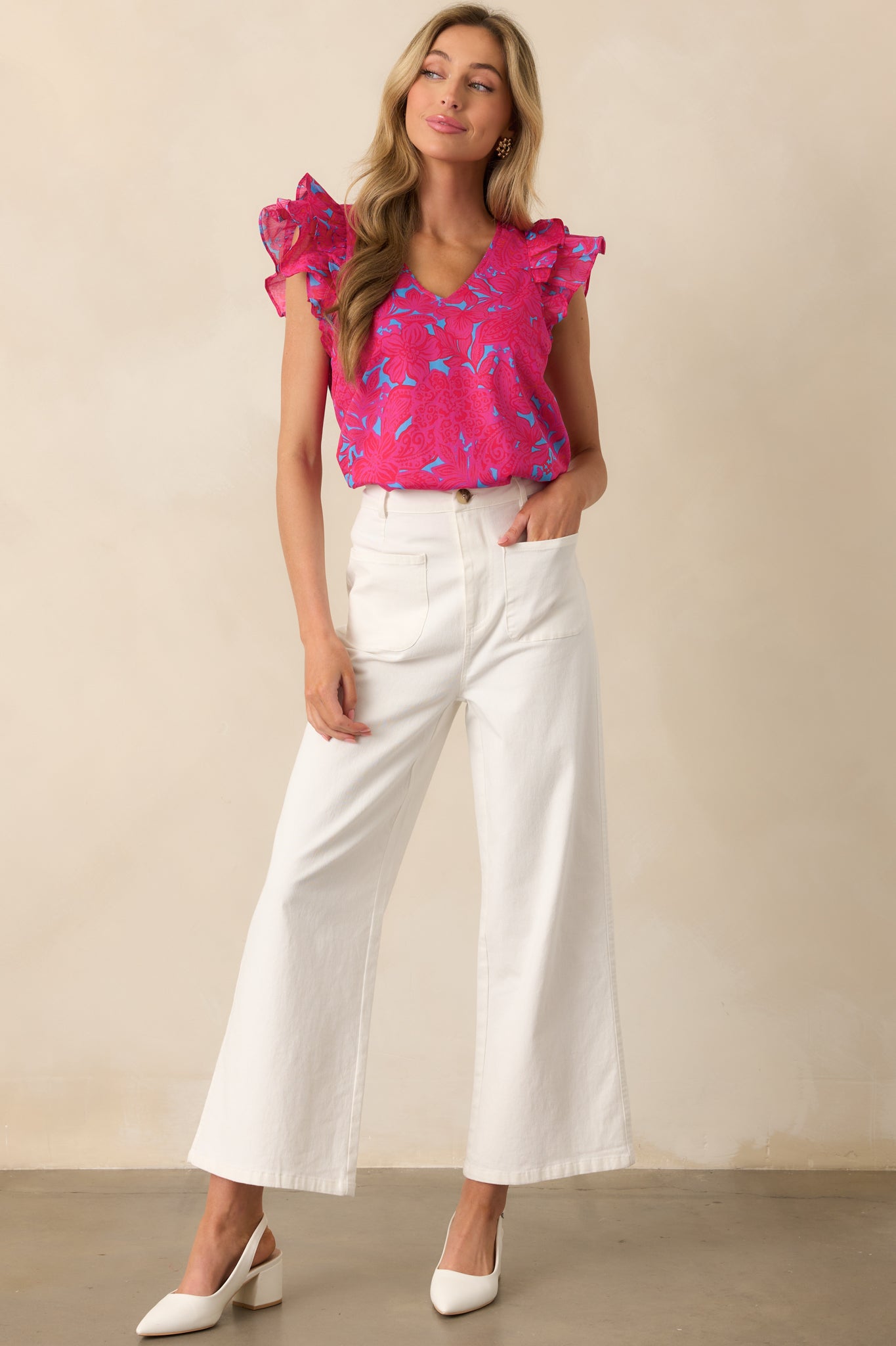 Full-length image of a relaxed fit fuchsia top, showcasing the floral pattern and soft cotton fabric.