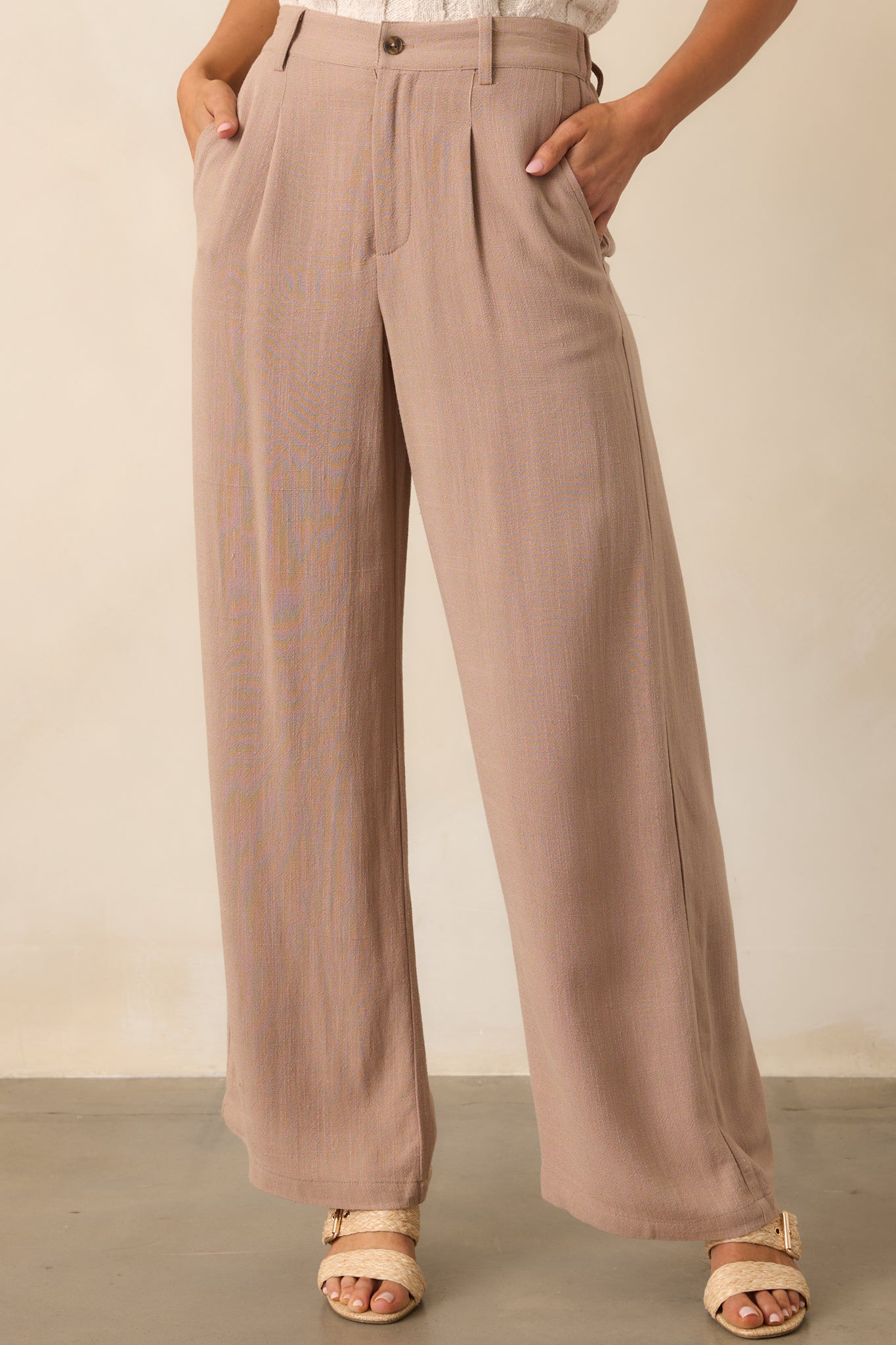 Focused view of the waistband with zipper and button closure, showing the functional belt loops and elastic back waist insert.