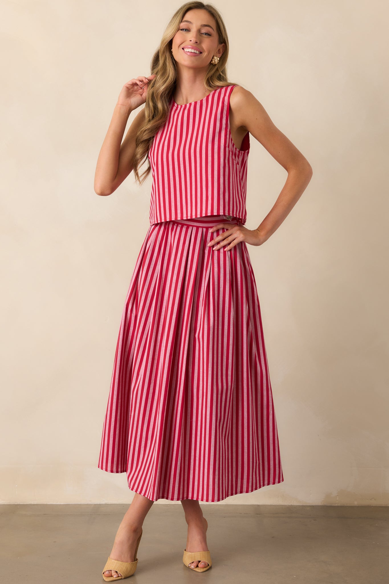 Full-length image of the red cotton top, showcasing the vertical stripe pattern and relaxed silhouette.