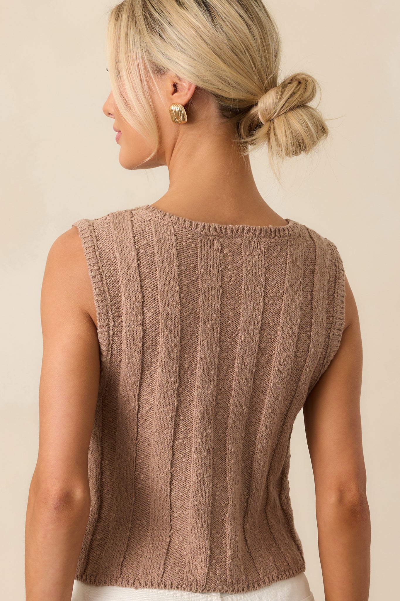 Back view of the tan iced coffee top, showcasing the sleeveless design and ribbed texture along the entire length.