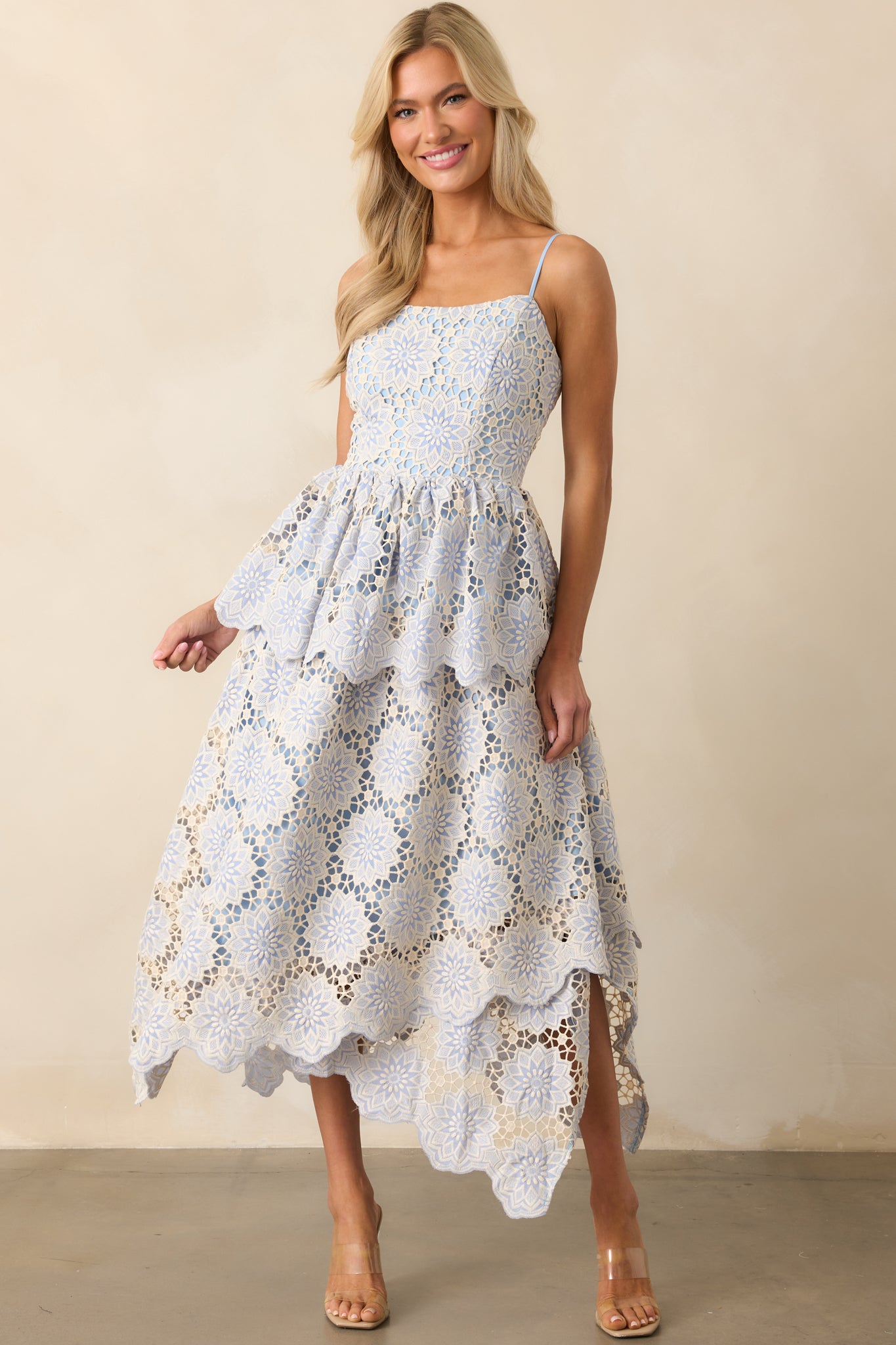 Complete front view of the sky blue dress featuring ivory geometric embroidery and a relaxed fit with a tiered skirt.